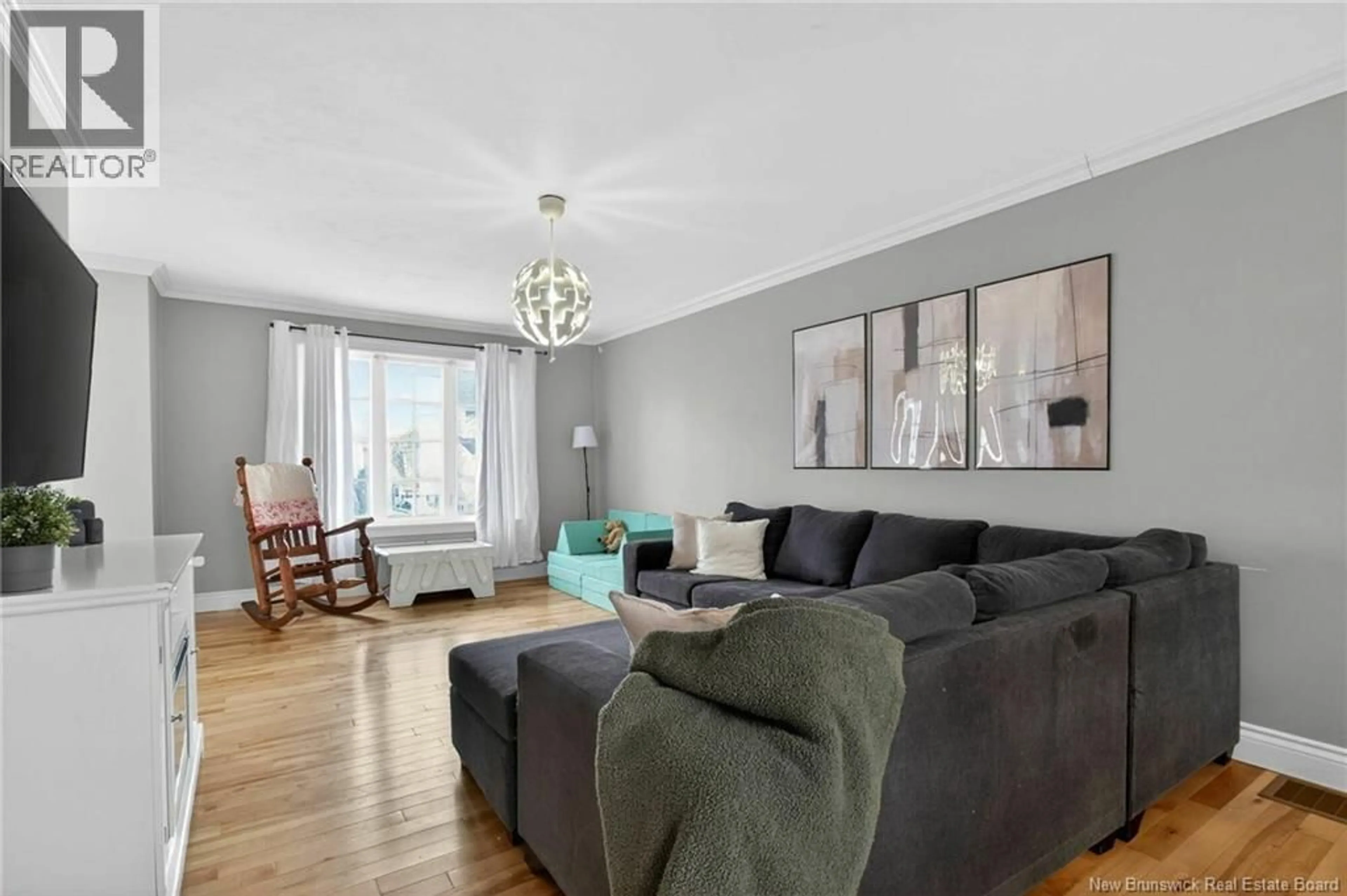Living room with furniture, wood/laminate floor for 19 BLANCHARD STREET, Dieppe New Brunswick E1A0R8