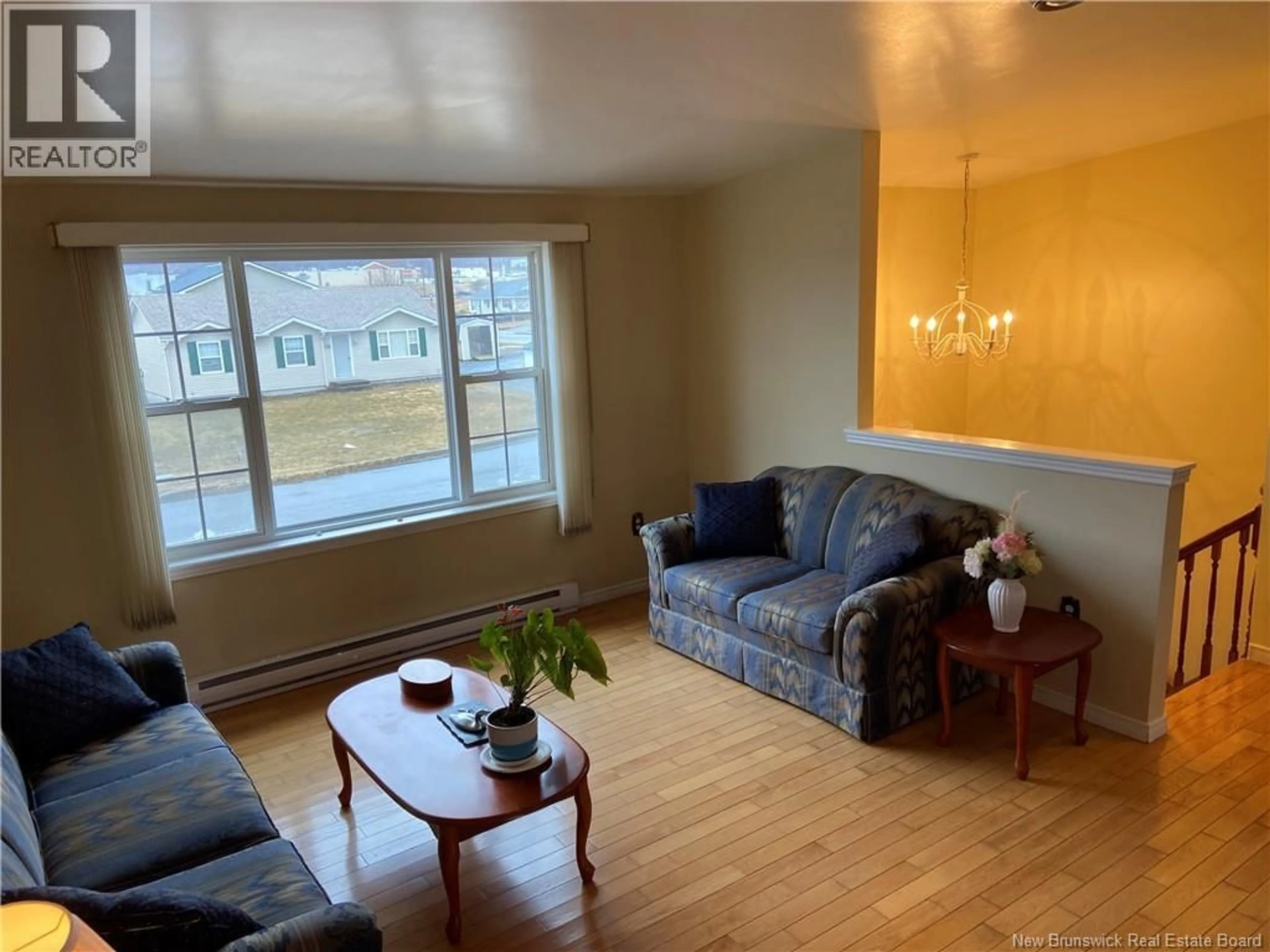 Living room with furniture, wood/laminate floor for 110 HONEYSUCKLE DRIVE, Saint John New Brunswick E2M5T1