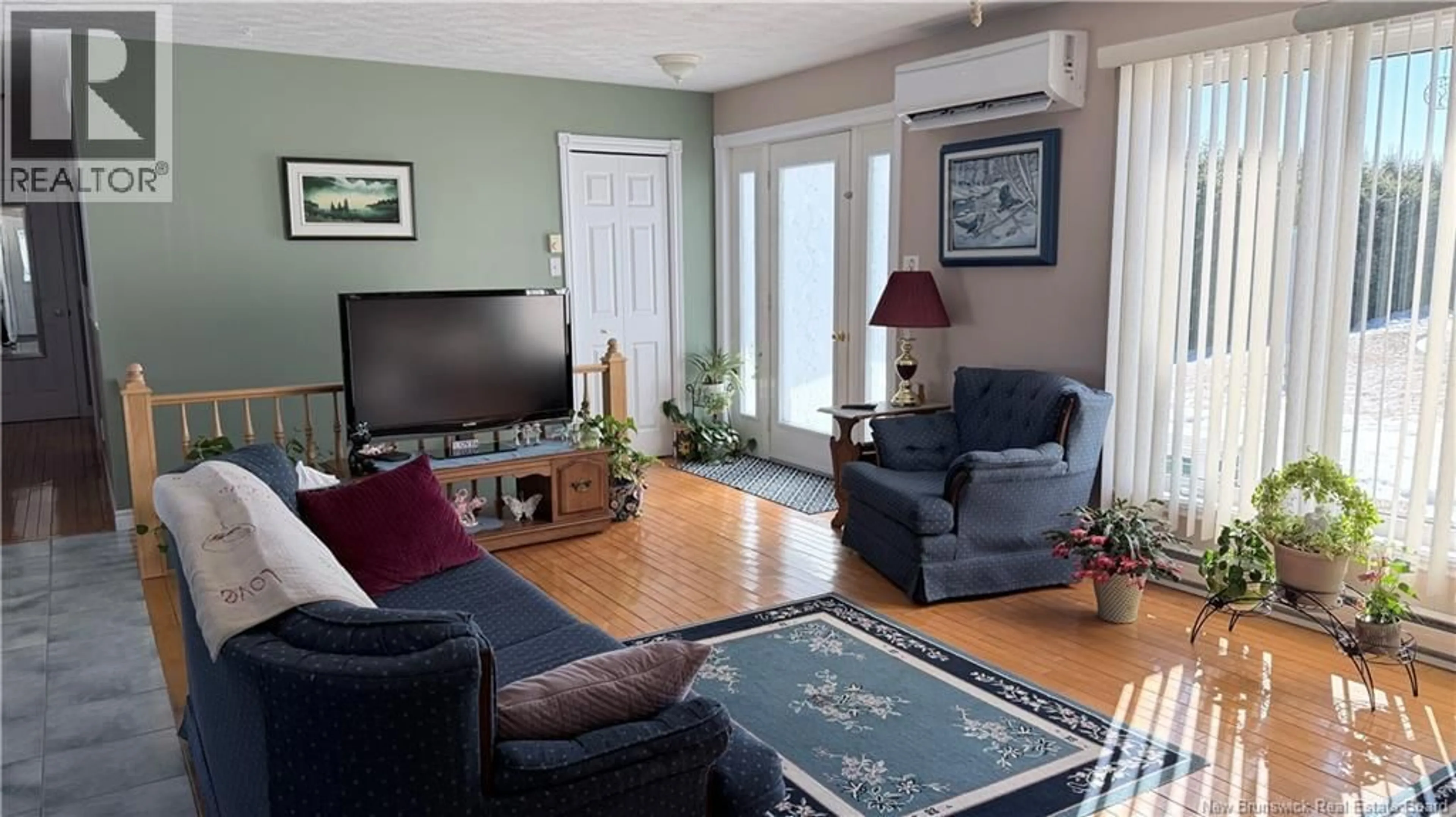 Living room with furniture, wood/laminate floor for 168 BEVERLY STREET, Grand Falls New Brunswick E3Z1A9