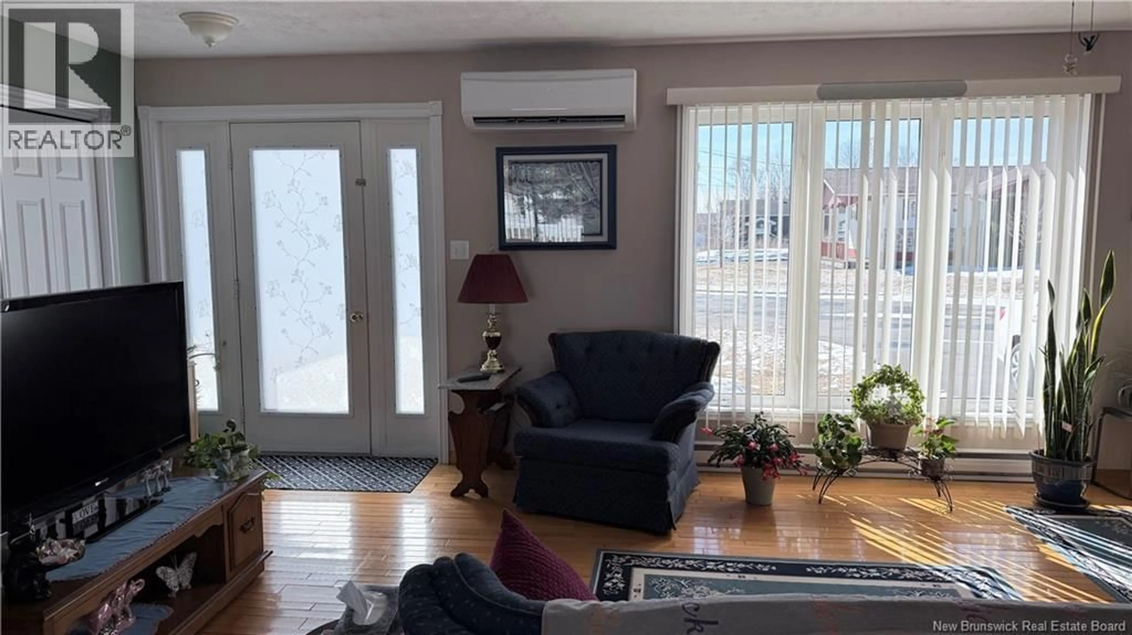 Living room with furniture, wood/laminate floor for 168 BEVERLY STREET, Grand Falls New Brunswick E3Z1A9