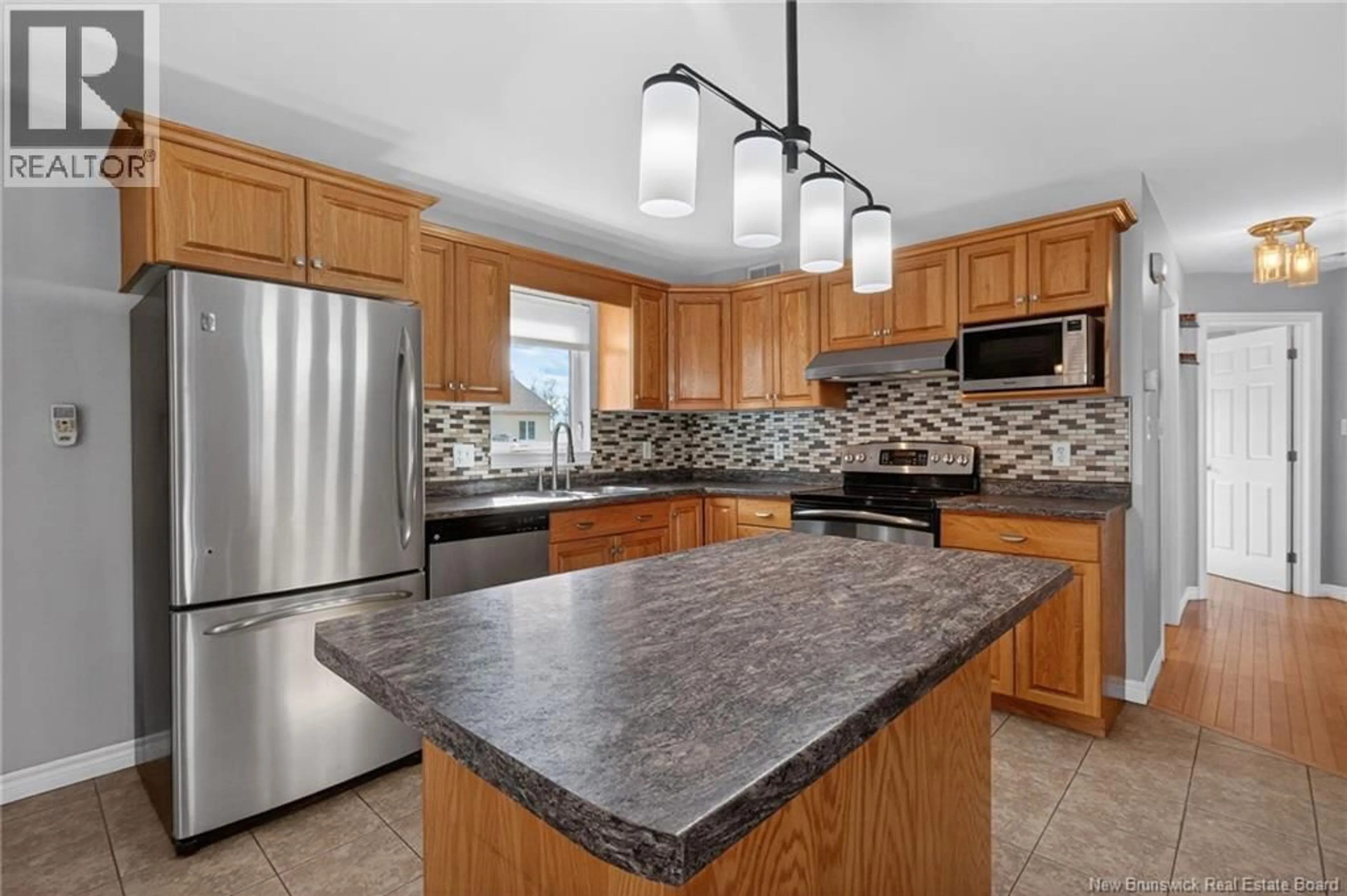 Open concept kitchen, ceramic/tile floor for 147 THERIAULT, Dieppe New Brunswick E1A8B1