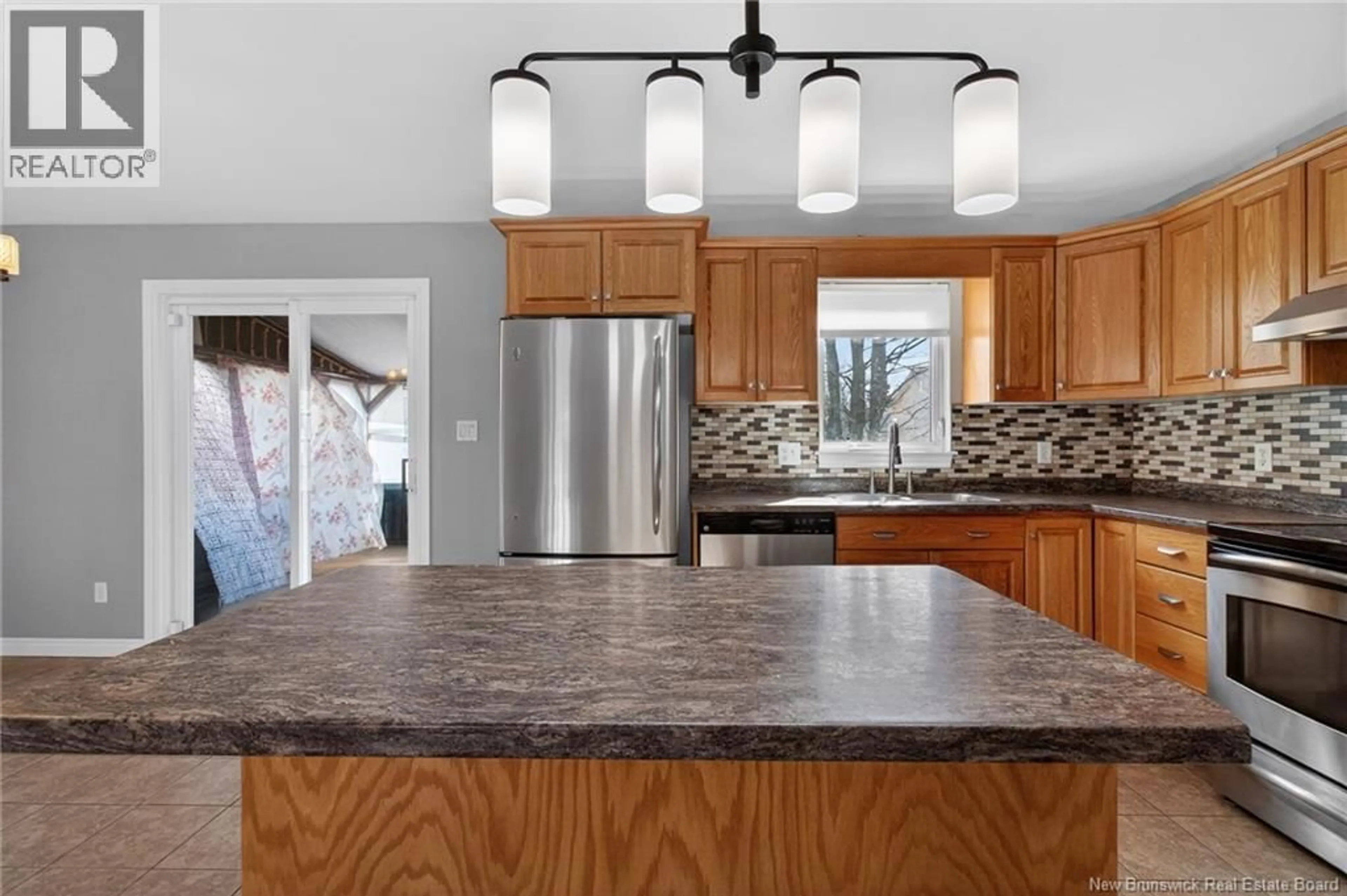 Open concept kitchen, ceramic/tile floor for 147 THERIAULT, Dieppe New Brunswick E1A8B1
