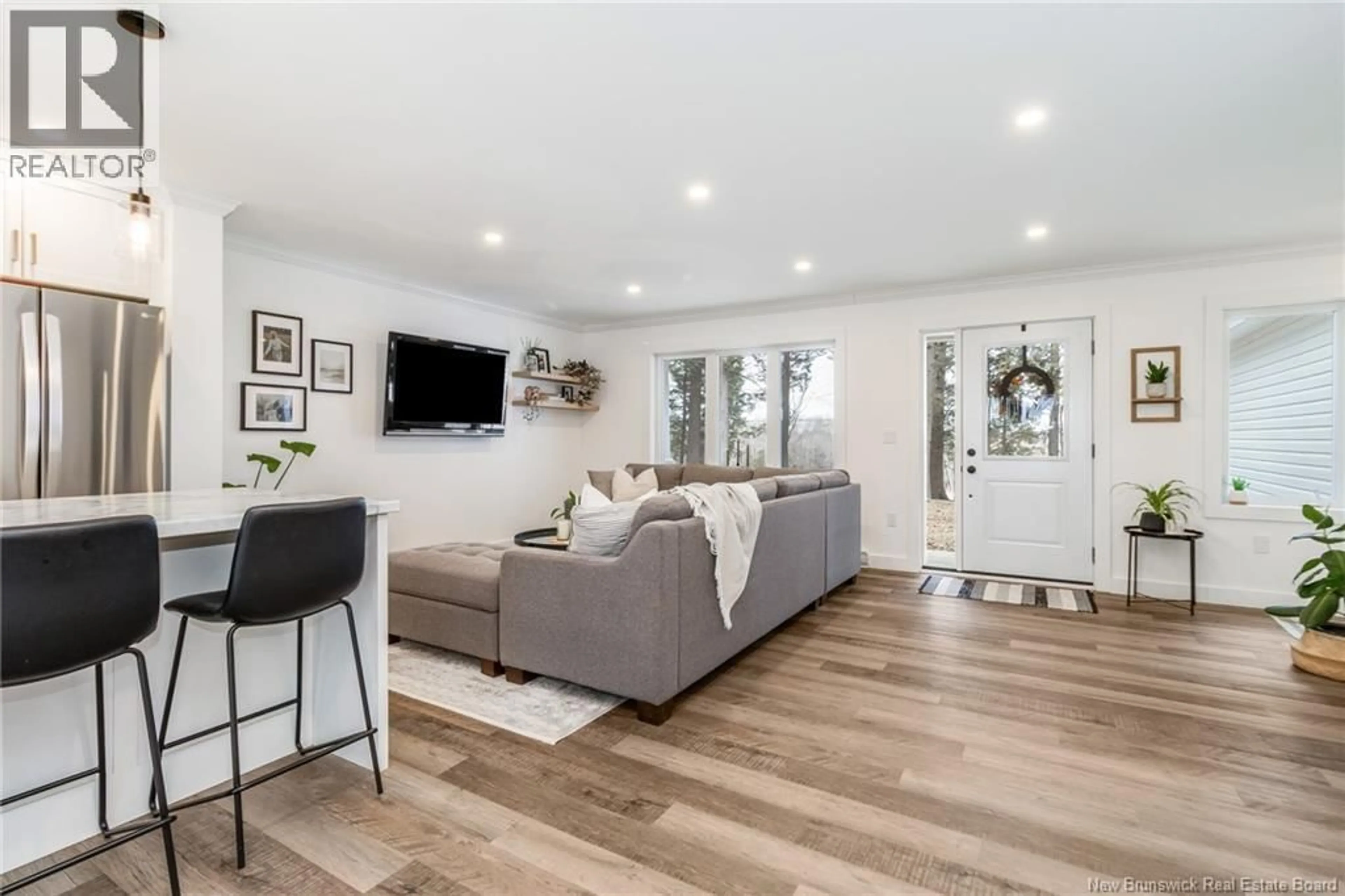 Living room with furniture, wood/laminate floor for 208 CROCKS POINT ROAD, Keswick Ridge New Brunswick E6L1T5