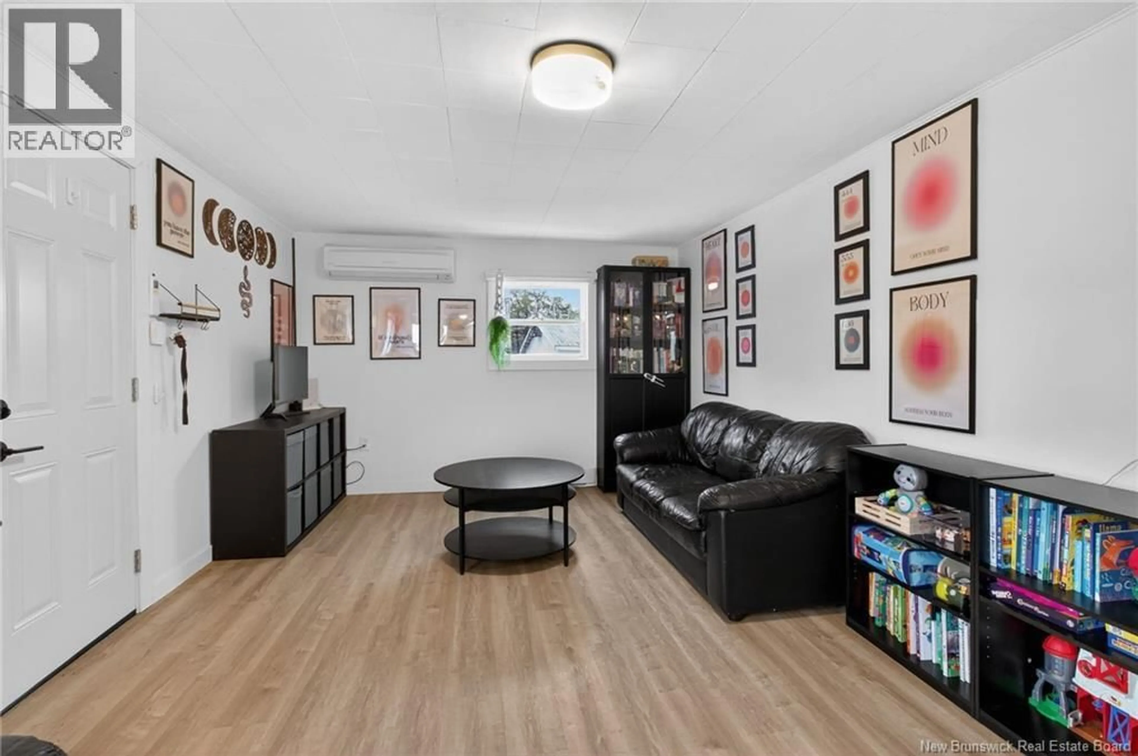 Living room with furniture, wood/laminate floor for 8413 ROUTE 126, Harcourt New Brunswick E4T3A1