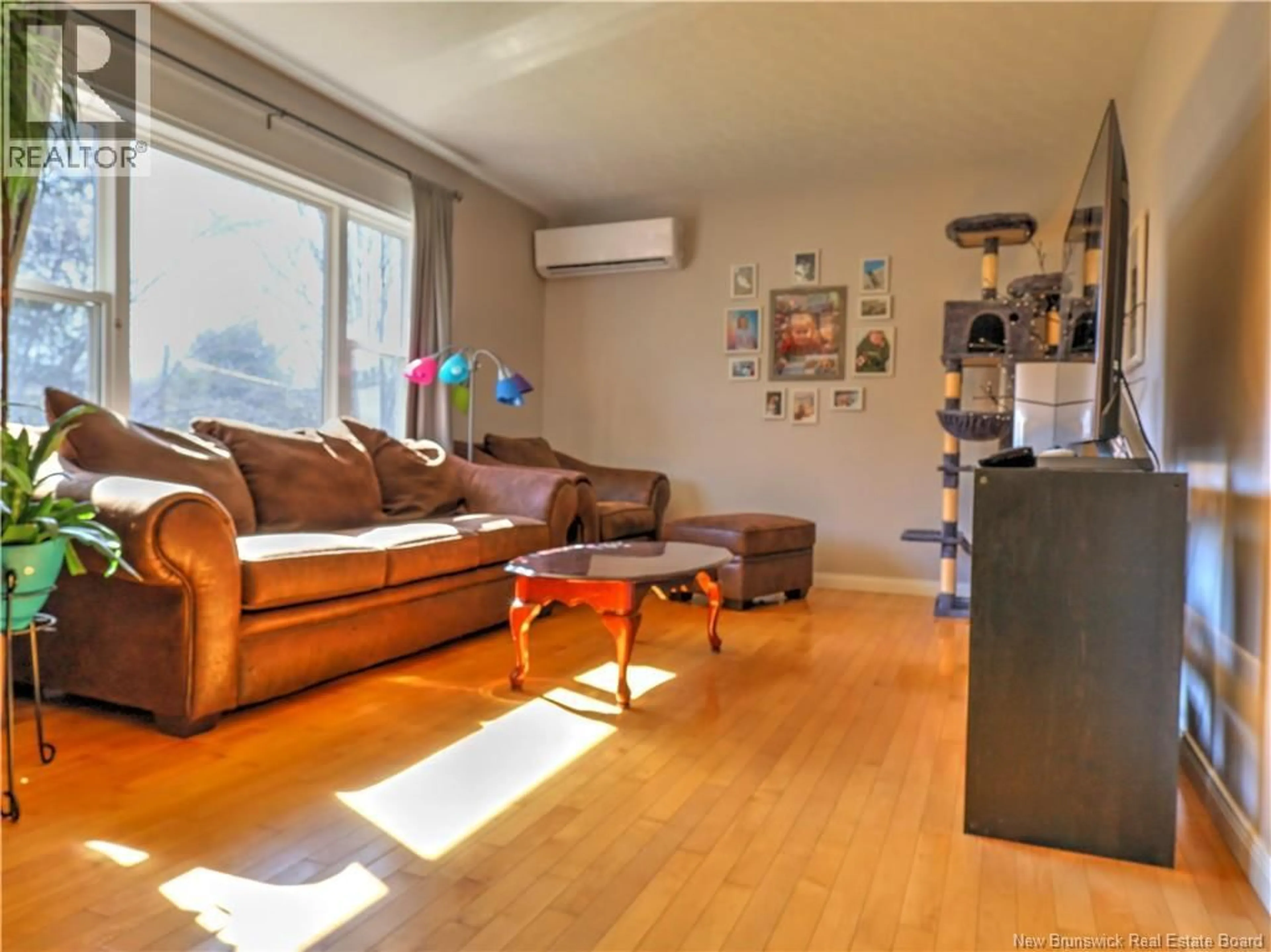 Living room with furniture, wood/laminate floor for 126 CHRISTOPHER DRIVE, Burton New Brunswick E2V3H6