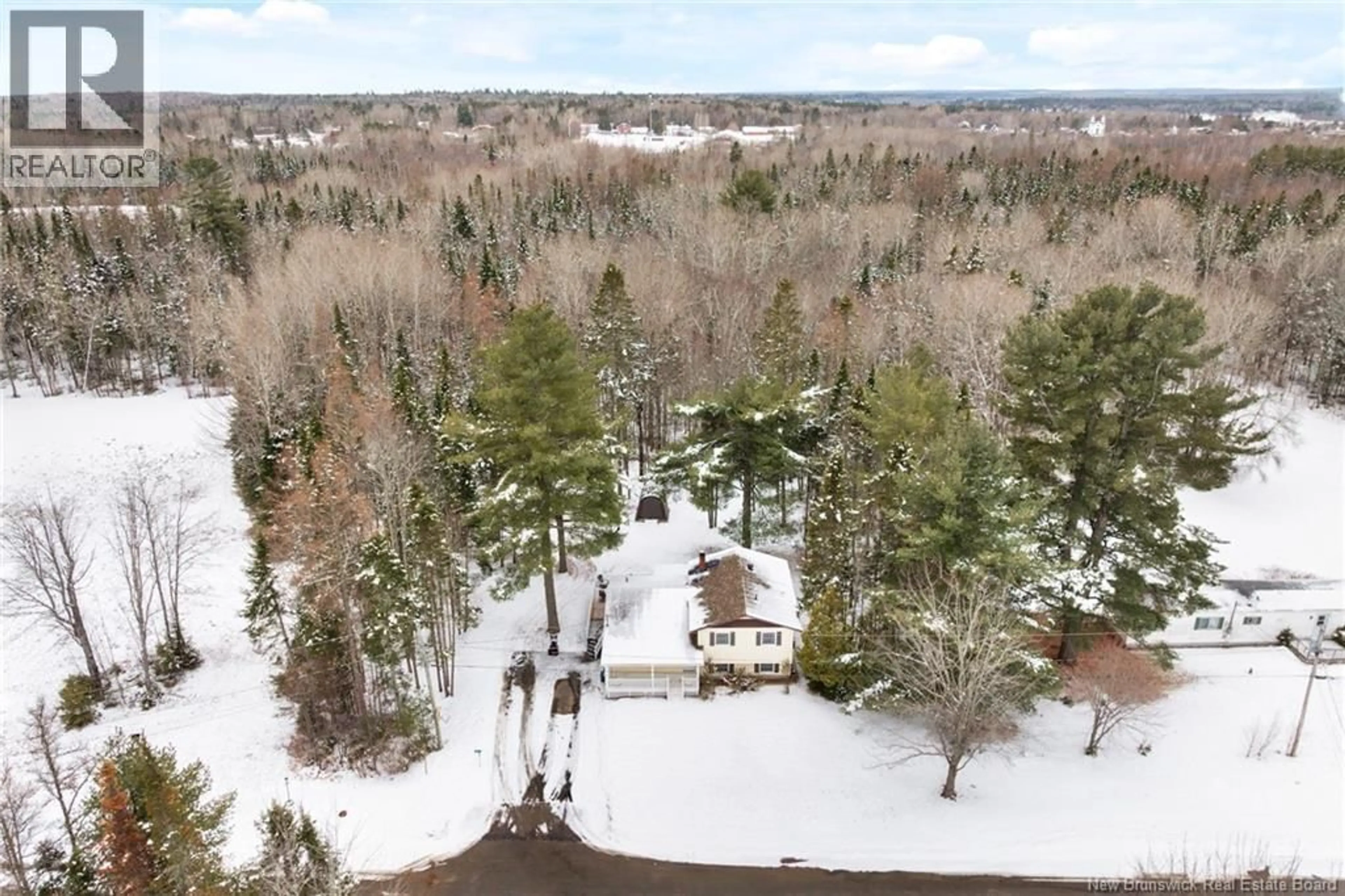 A pic from outside/outdoor area/front of a property/back of a property/a pic from drone, forest/trees view for 64 MAPLE STREET, Chipman New Brunswick E4A1Y7