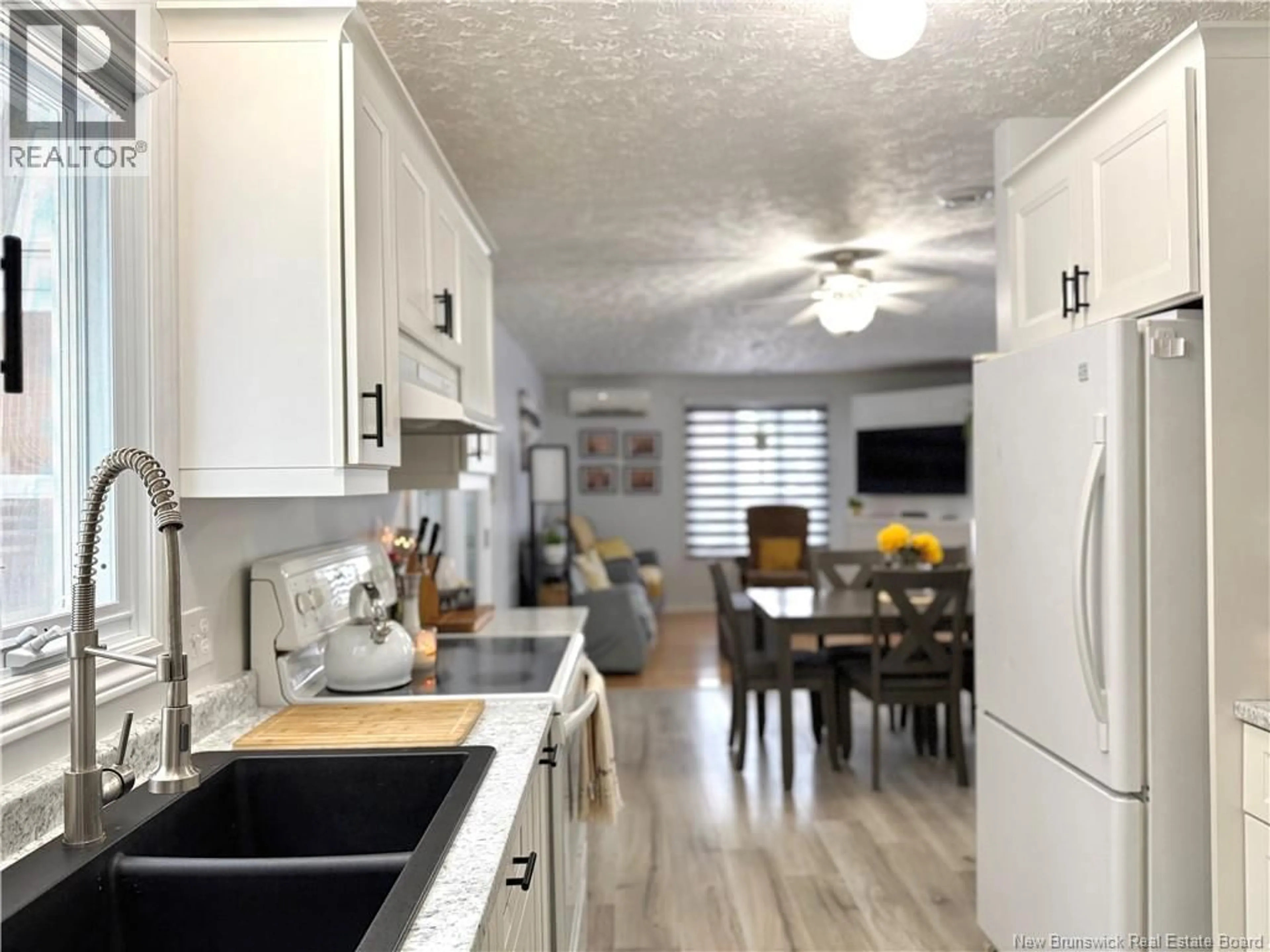 Open concept kitchen, wood/laminate floor for 15 MARTIN STREET, Clair New Brunswick E7A2G3