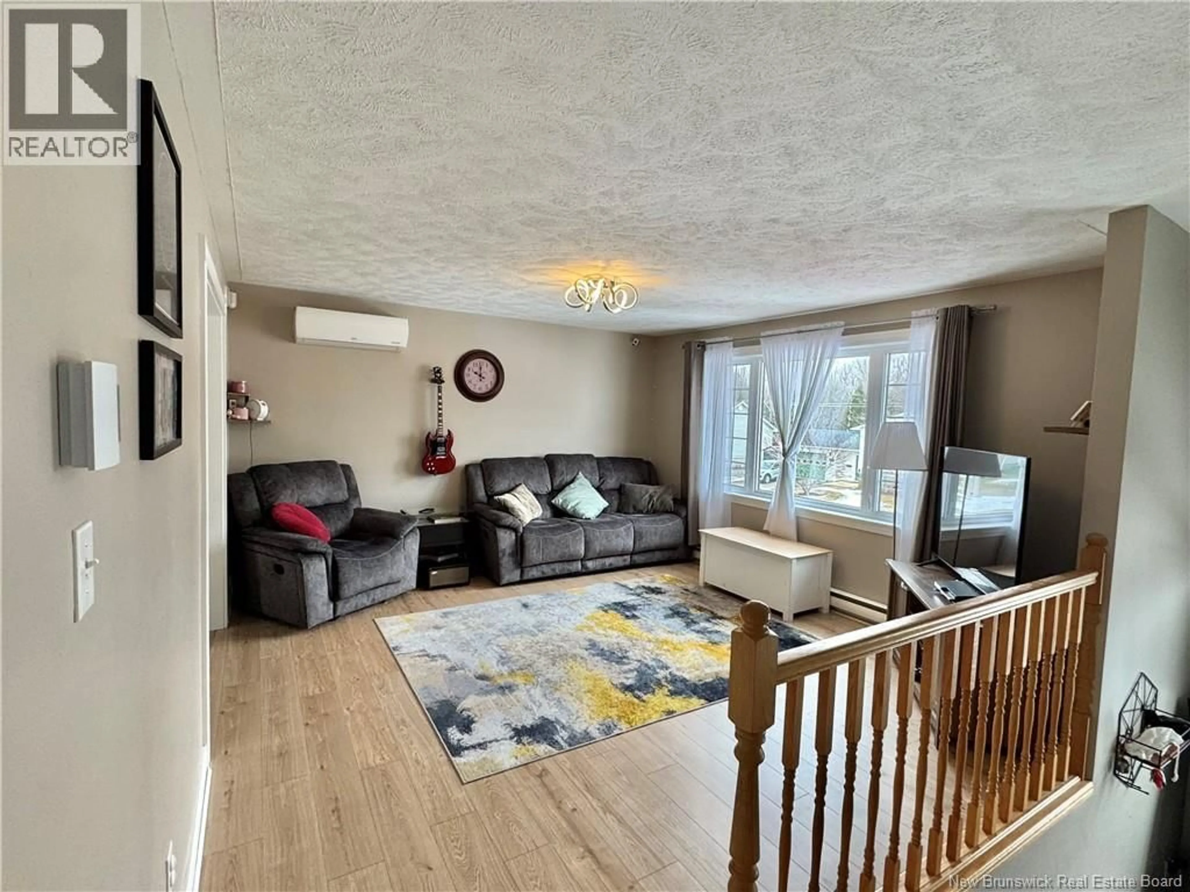 Living room with furniture, wood/laminate floor for 33 LANSDOWN AVENUE, Oromocto New Brunswick E2V4J7