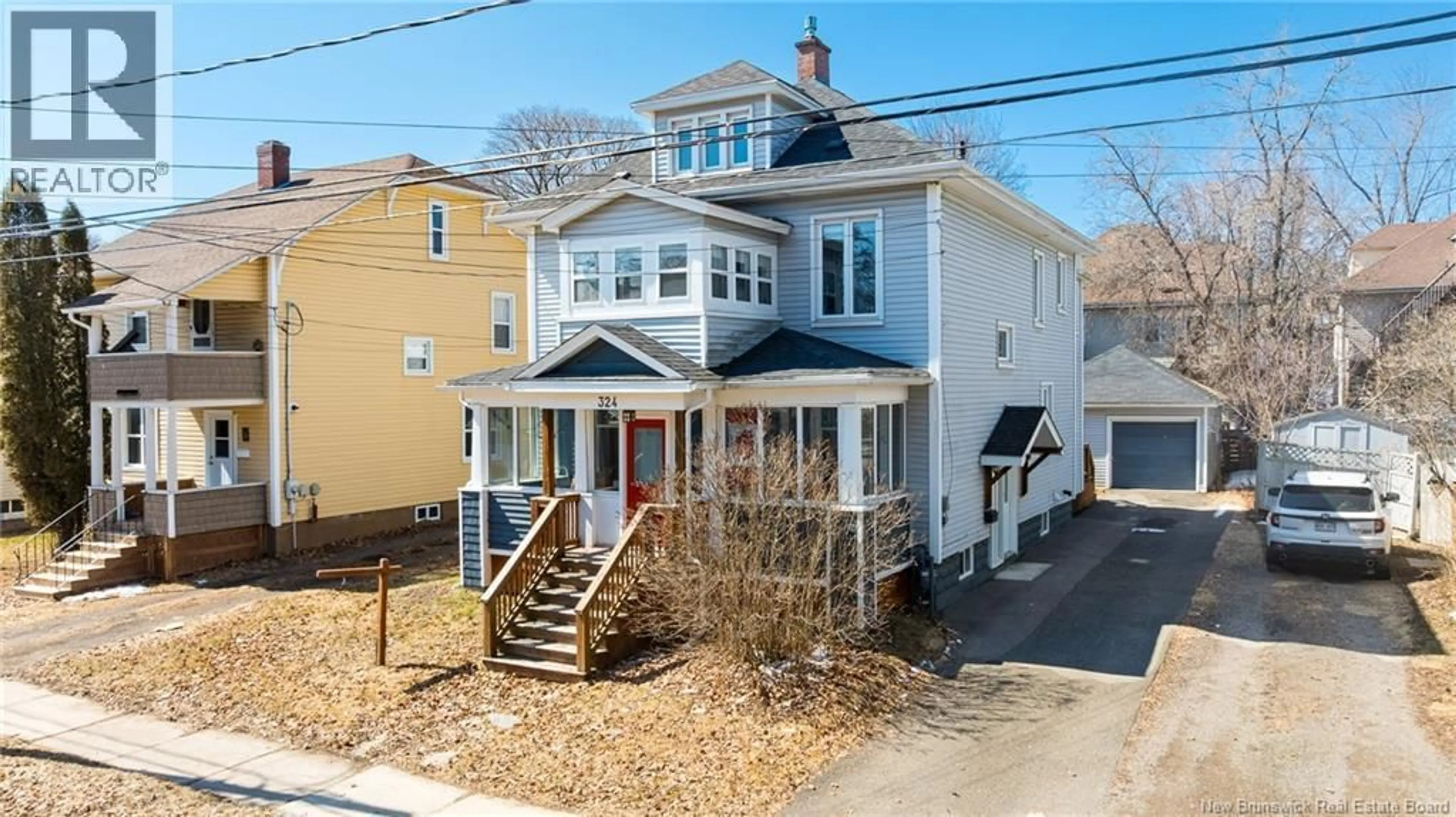 A pic from outside/outdoor area/front of a property/back of a property/a pic from drone, street for 324 HIGH ST, Moncton New Brunswick E1C6C3