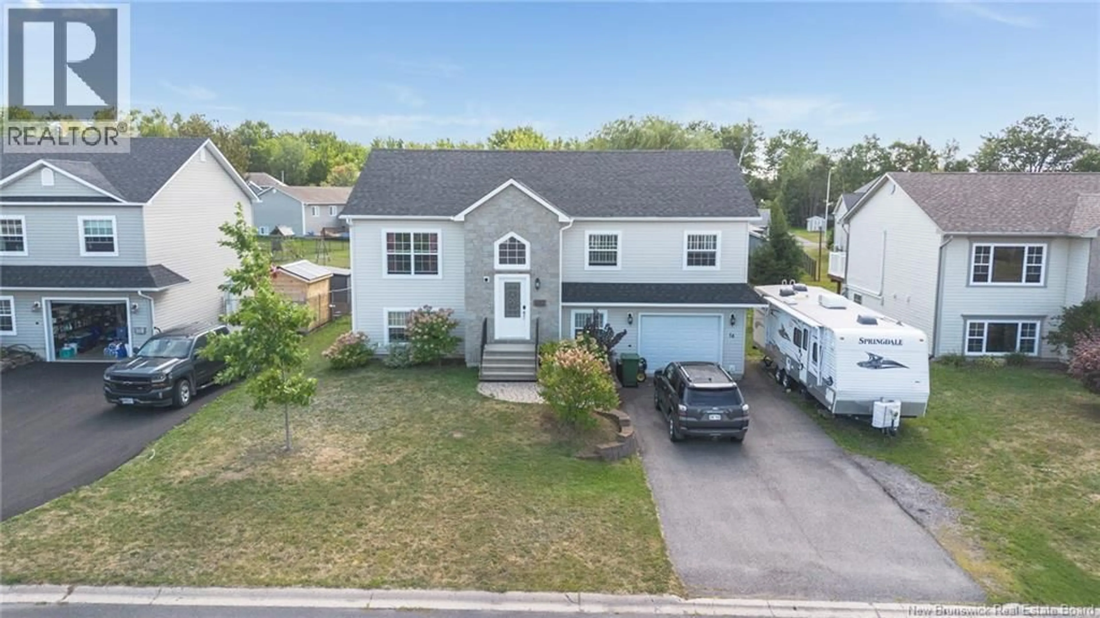 A pic from outside/outdoor area/front of a property/back of a property/a pic from drone, street for 14 HALLIHAN DRIVE, Oromocto New Brunswick E2V0C5