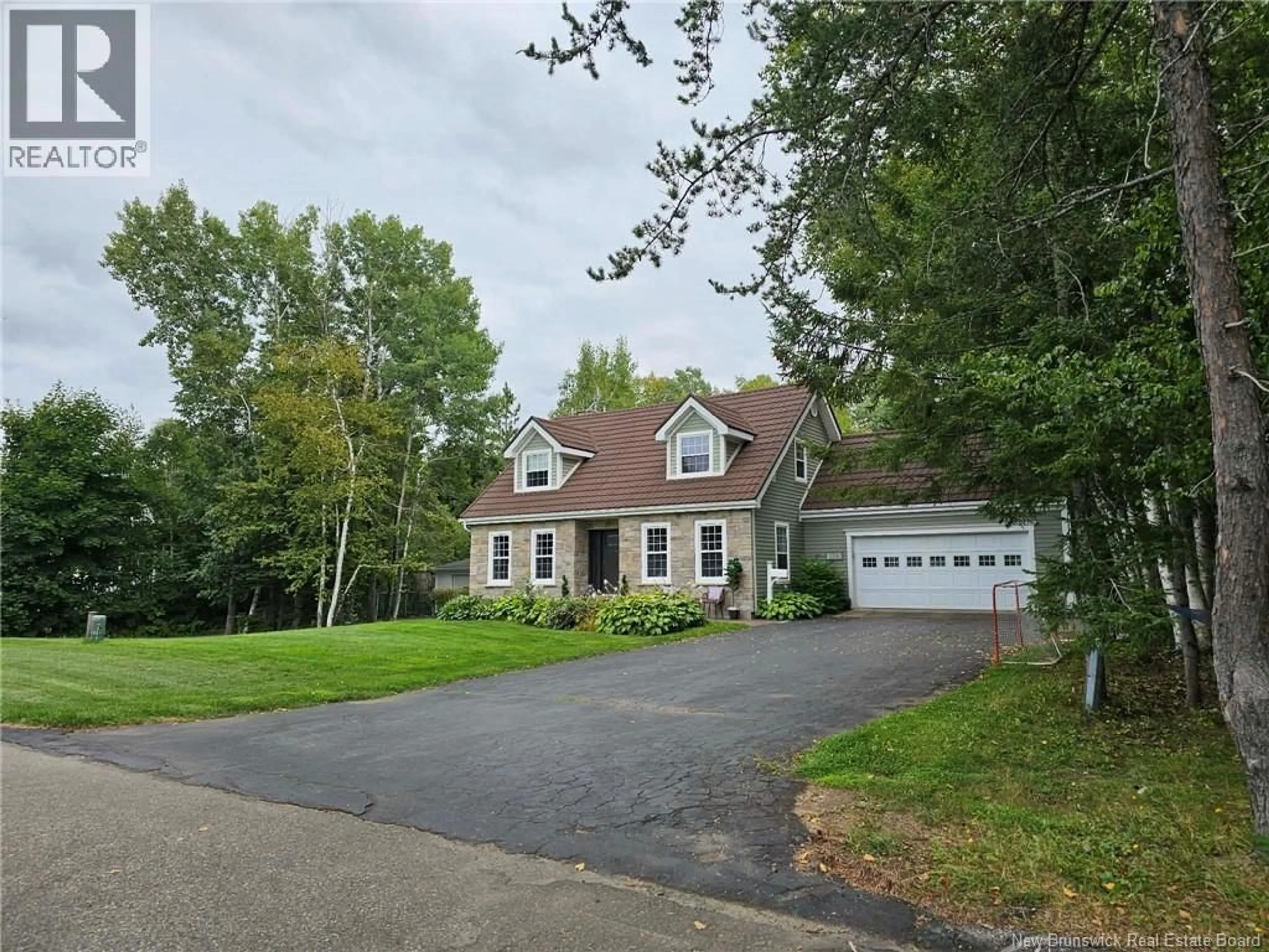 A pic from outside/outdoor area/front of a property/back of a property/a pic from drone, street for 1025 TAMARACK, Bathurst New Brunswick E2A4G1