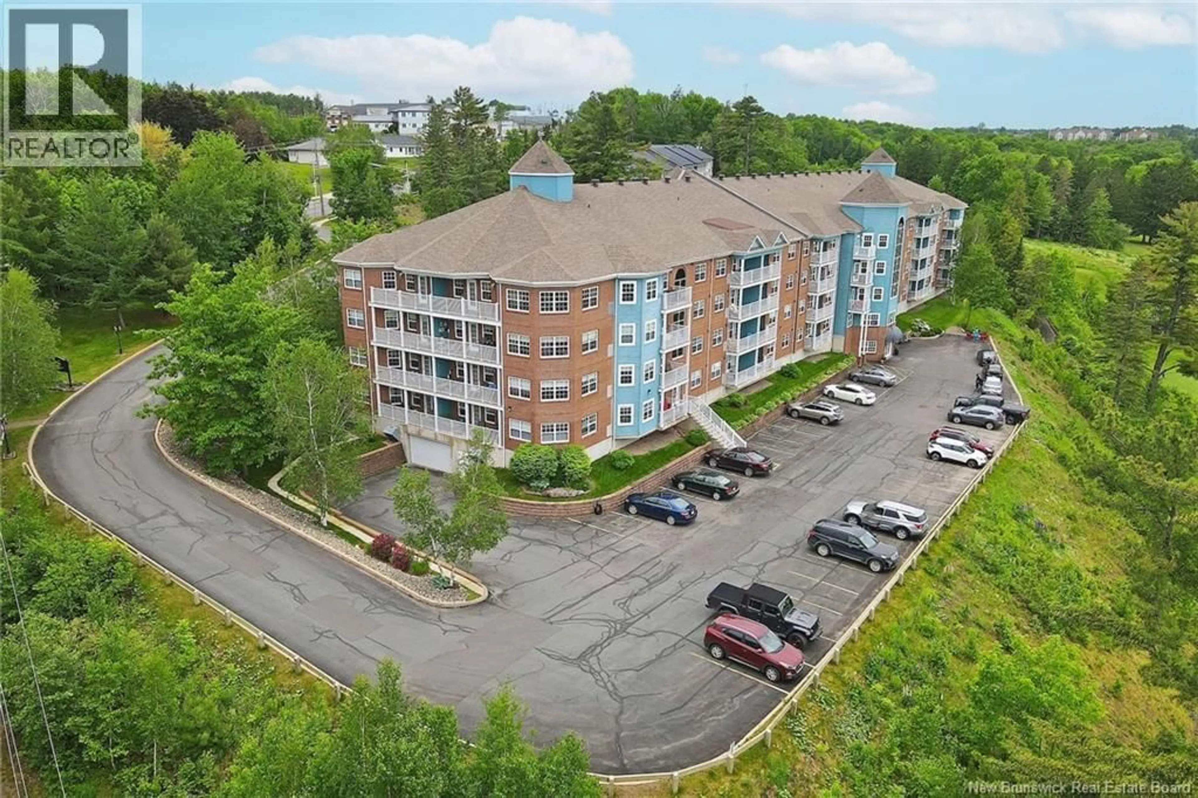 A pic from outside/outdoor area/front of a property/back of a property/a pic from drone, building for 409 - 1 GOLF GREENS LANE, Fredericton New Brunswick E3B9T9