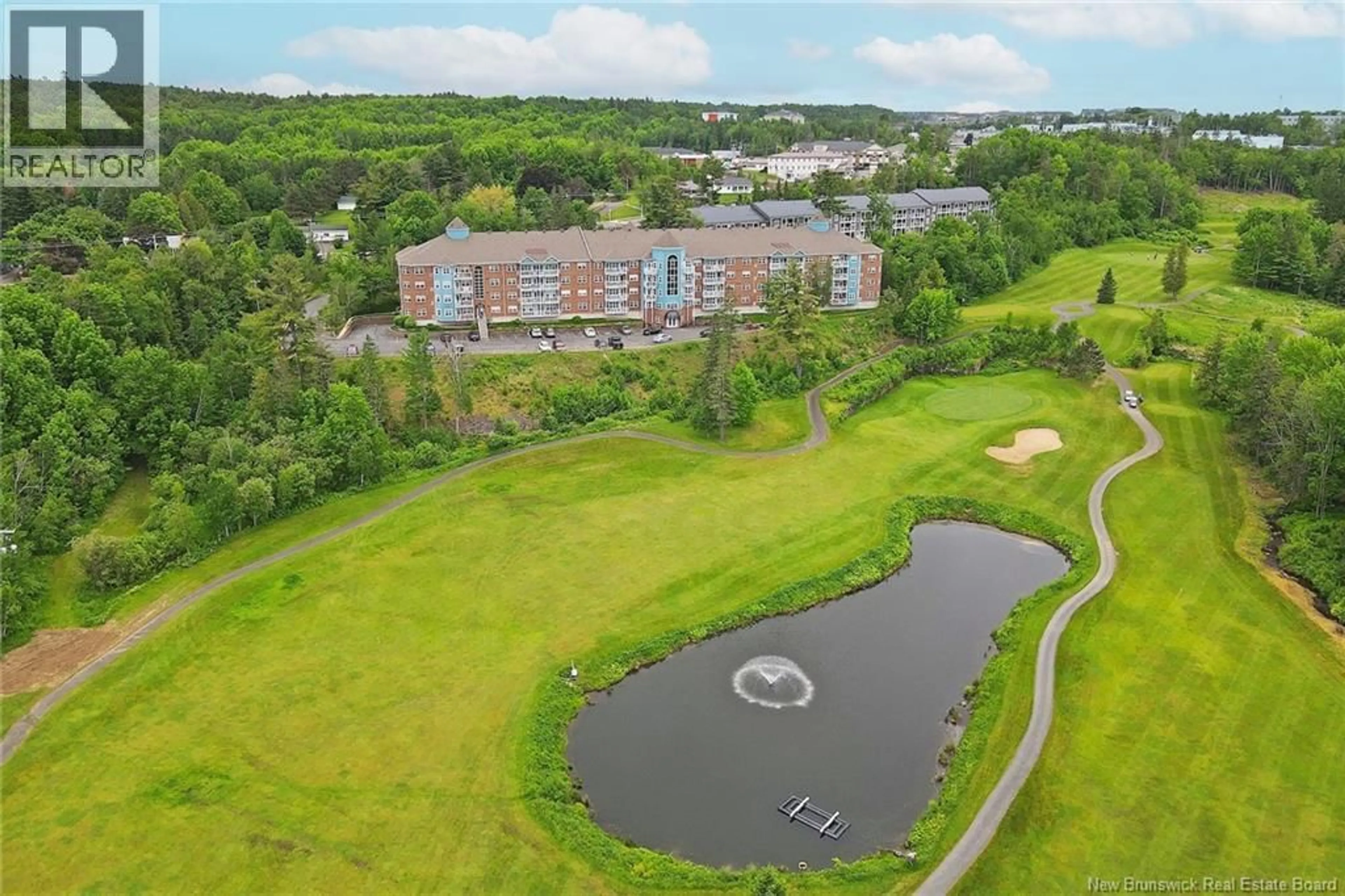 A pic from outside/outdoor area/front of a property/back of a property/a pic from drone, water/lake/river/ocean view for 409 - 1 GOLF GREENS LANE, Fredericton New Brunswick E3B9T9