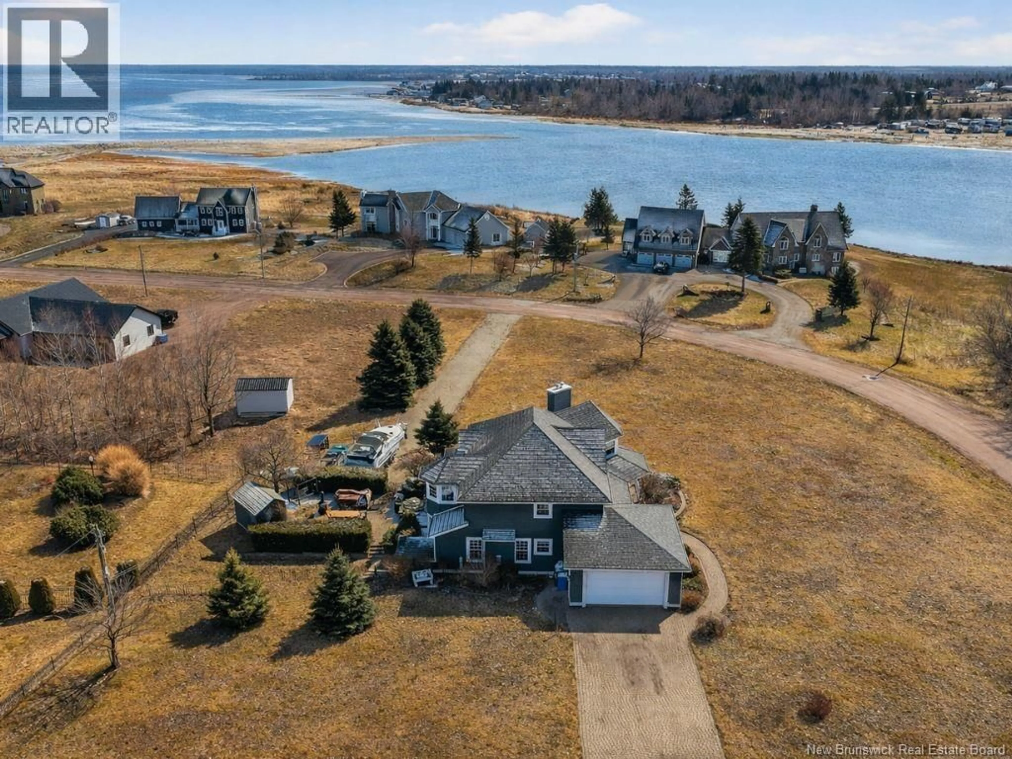 A pic from outside/outdoor area/front of a property/back of a property/a pic from drone, water/lake/river/ocean view for 92 MATHIEU MARTIN DRIVE, Grand-Barachois New Brunswick E4P7V8