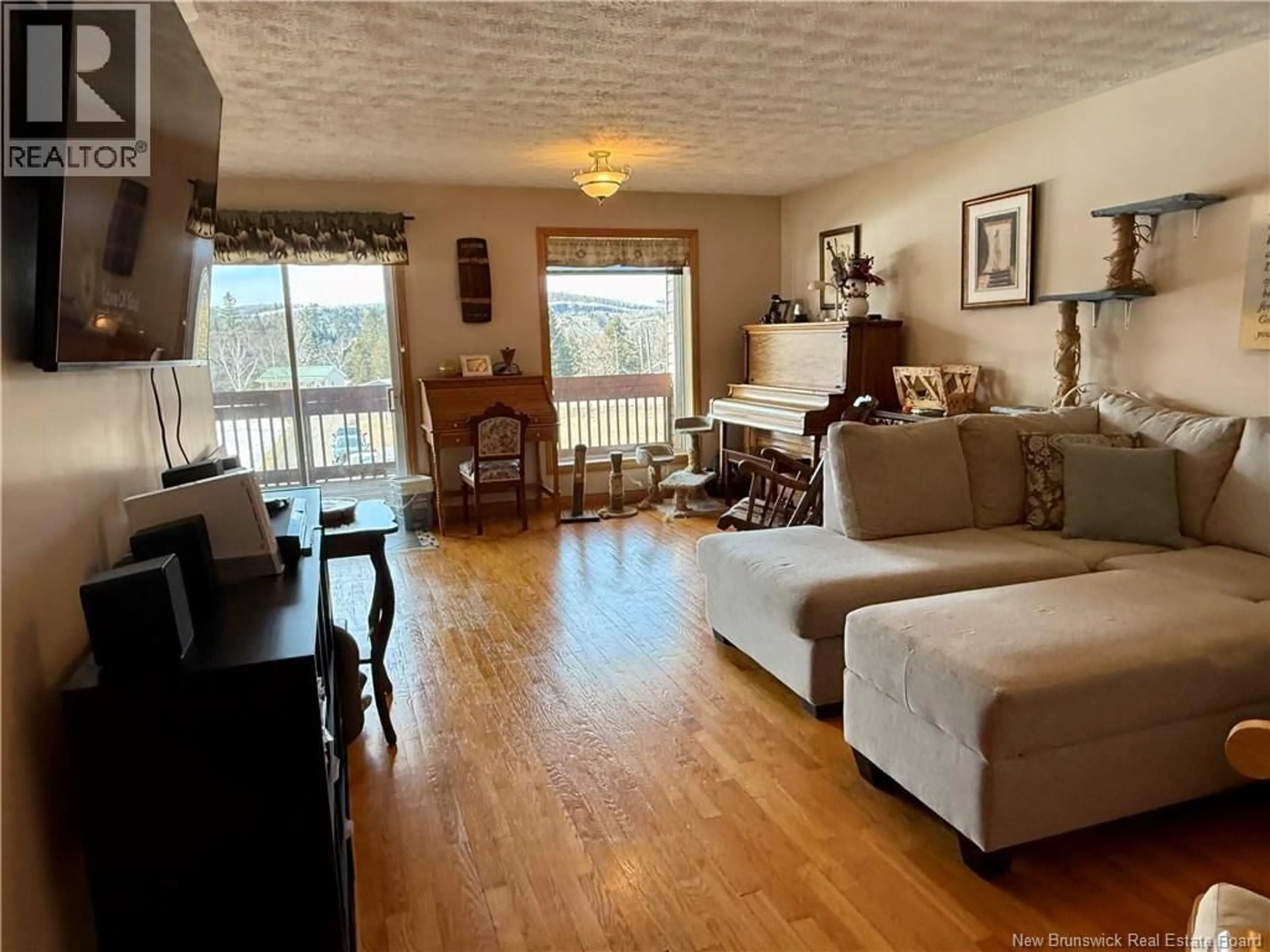 Living room with furniture, wood/laminate floor for 15782 HIGHWAY, Drummond New Brunswick E3Y2H5