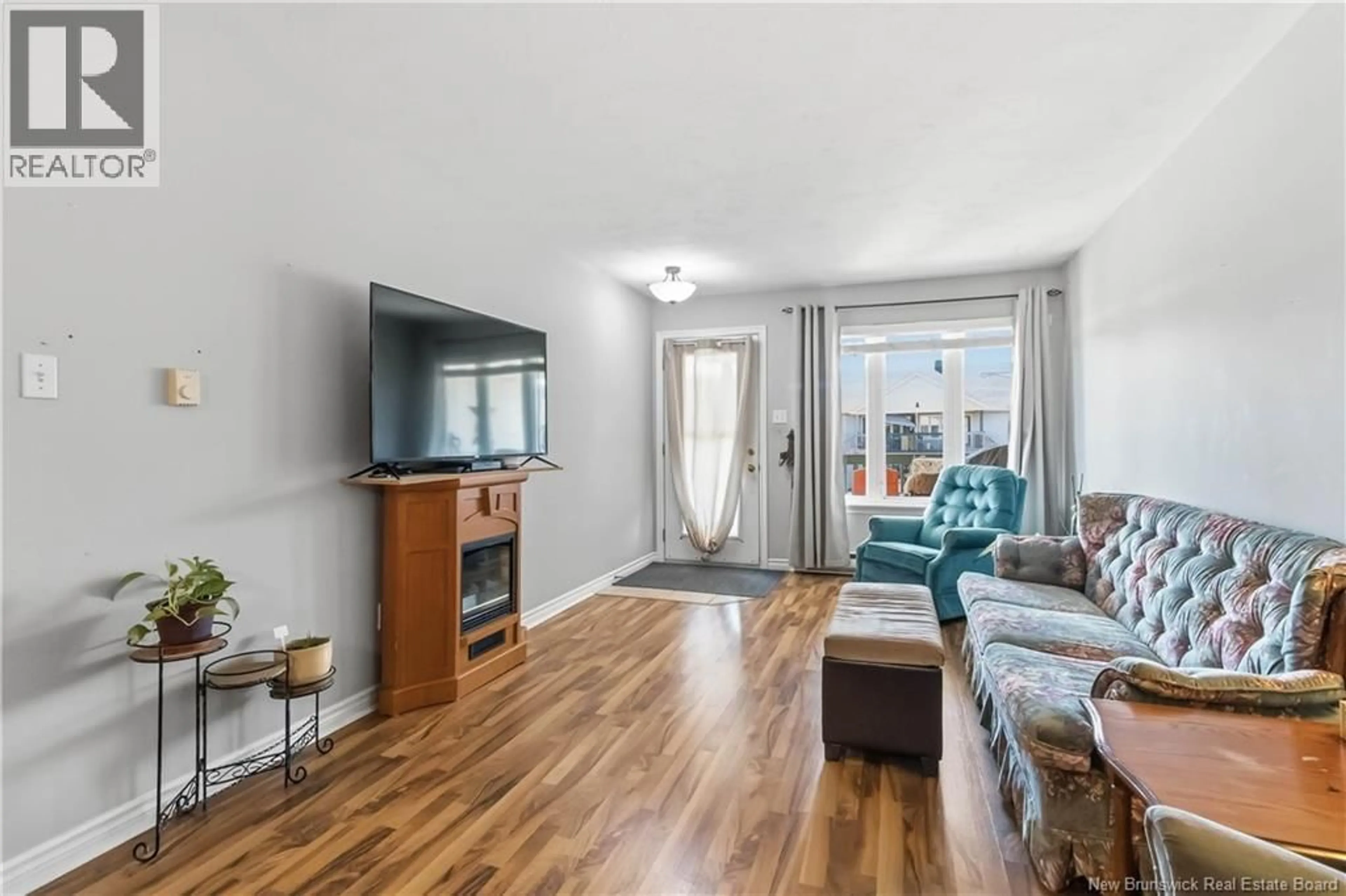Living room with furniture, wood/laminate floor for 27 - 30 GRANT STREET, Moncton New Brunswick E1A3R4