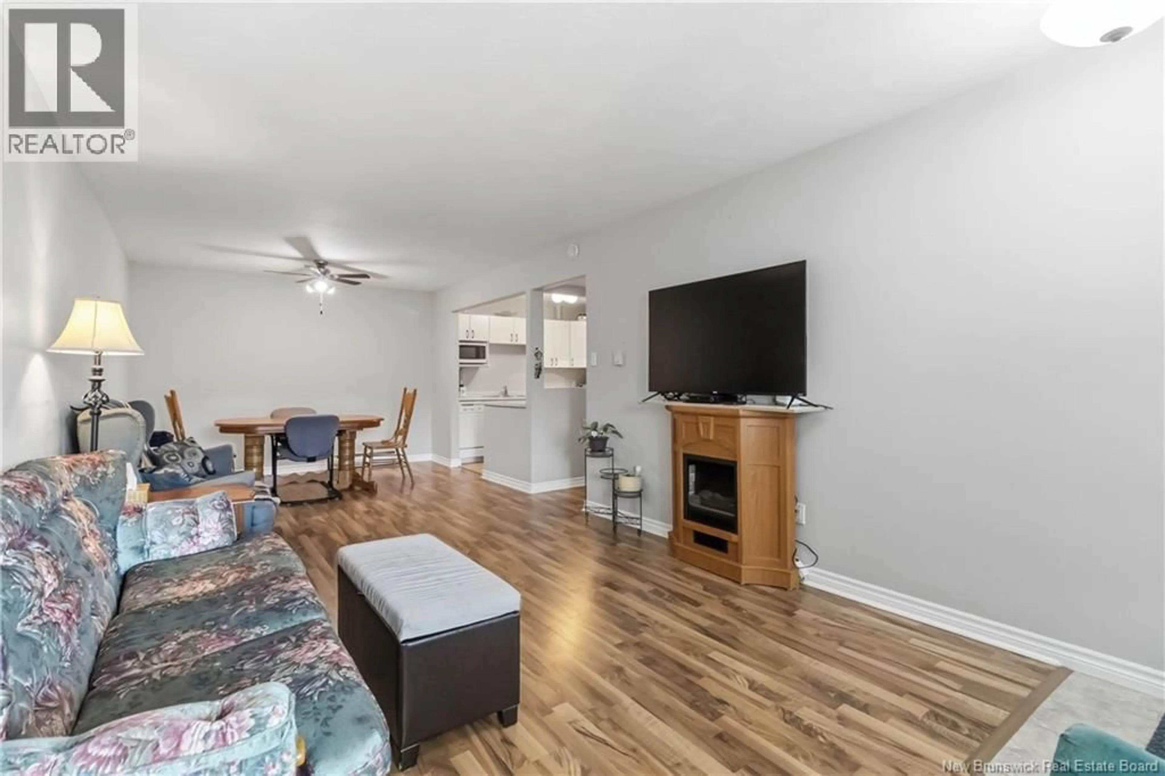 Living room with furniture, wood/laminate floor for 27 - 30 GRANT STREET, Moncton New Brunswick E1A3R4