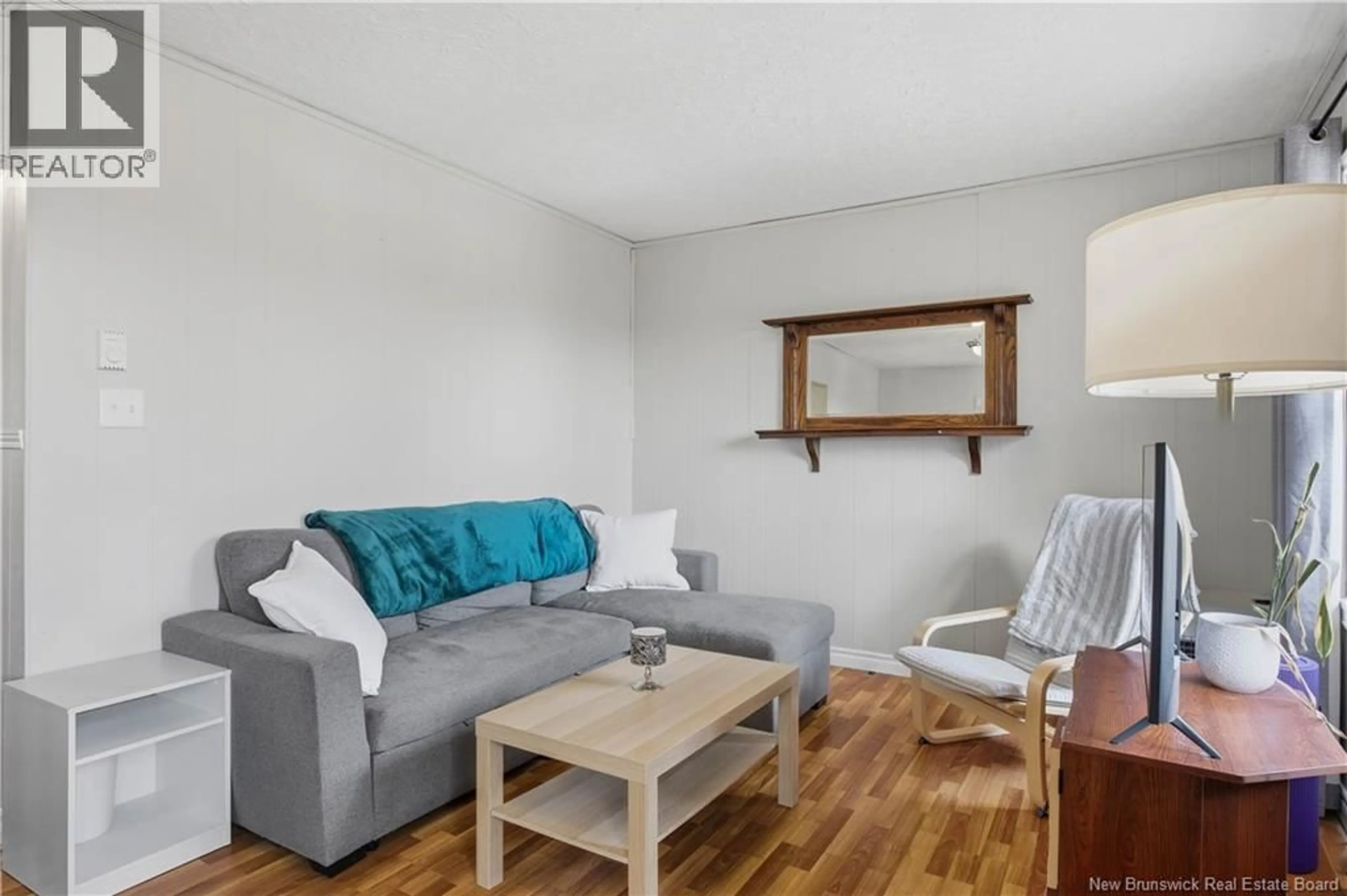 Living room with furniture, wood/laminate floor for 557 RIVER VALLEY DRIVE, Grand Bay-Westfield New Brunswick E5K1B2