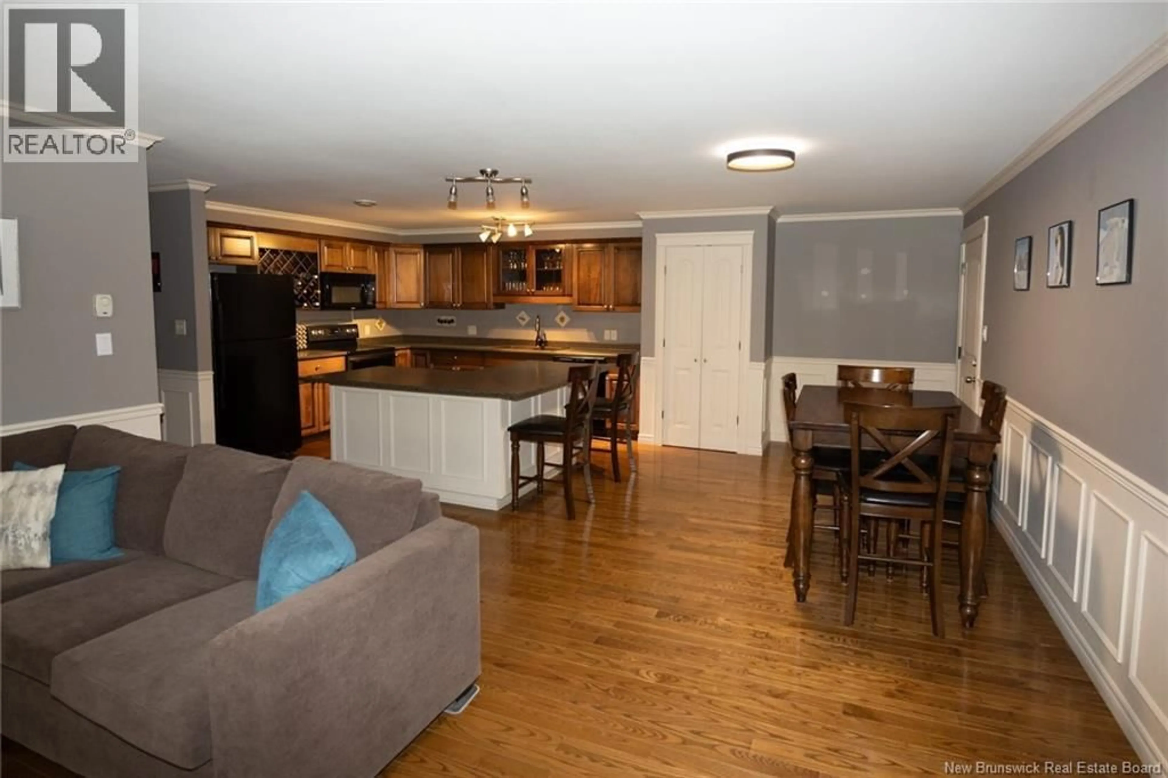 Open concept kitchen, wood/laminate floor for 104 - 170 VALCOUR DRIVE, Fredericton New Brunswick E3C0C9