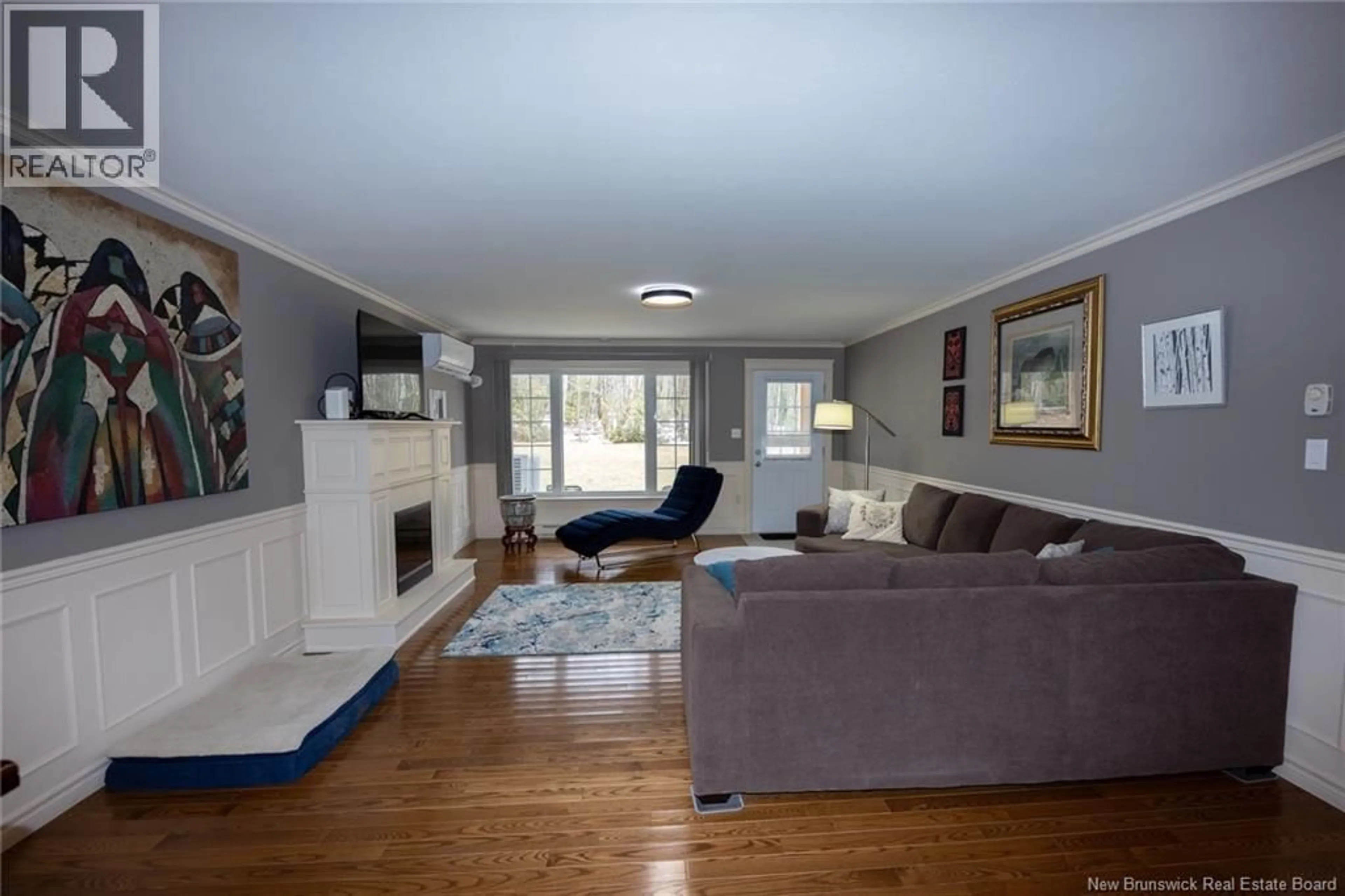 Living room with furniture, wood/laminate floor for 104 - 170 VALCOUR DRIVE, Fredericton New Brunswick E3C0C9