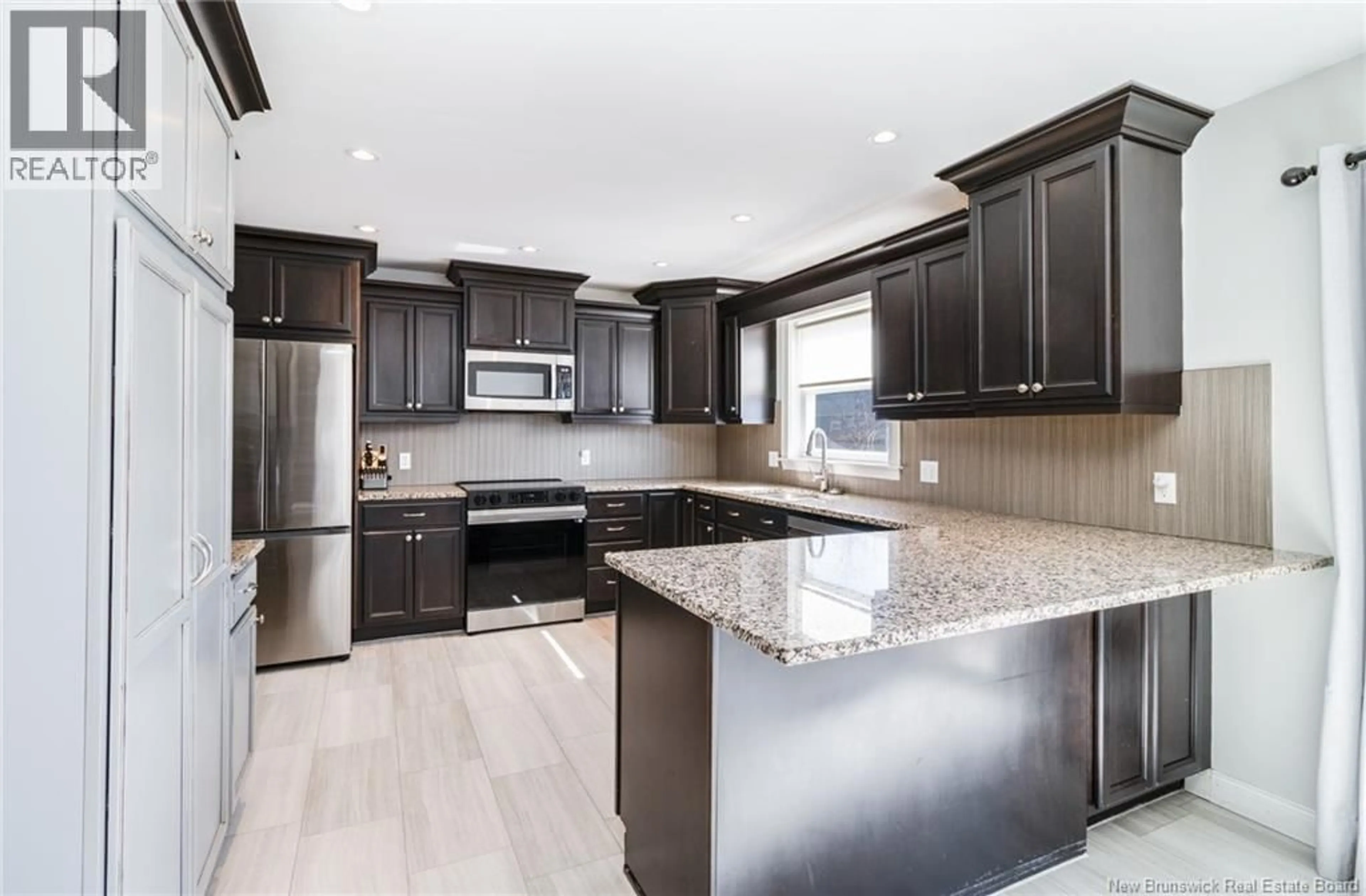 Open concept kitchen, ceramic/tile floor for 20 KNOWLTON CRESCENT, Oromocto New Brunswick E2V4S8