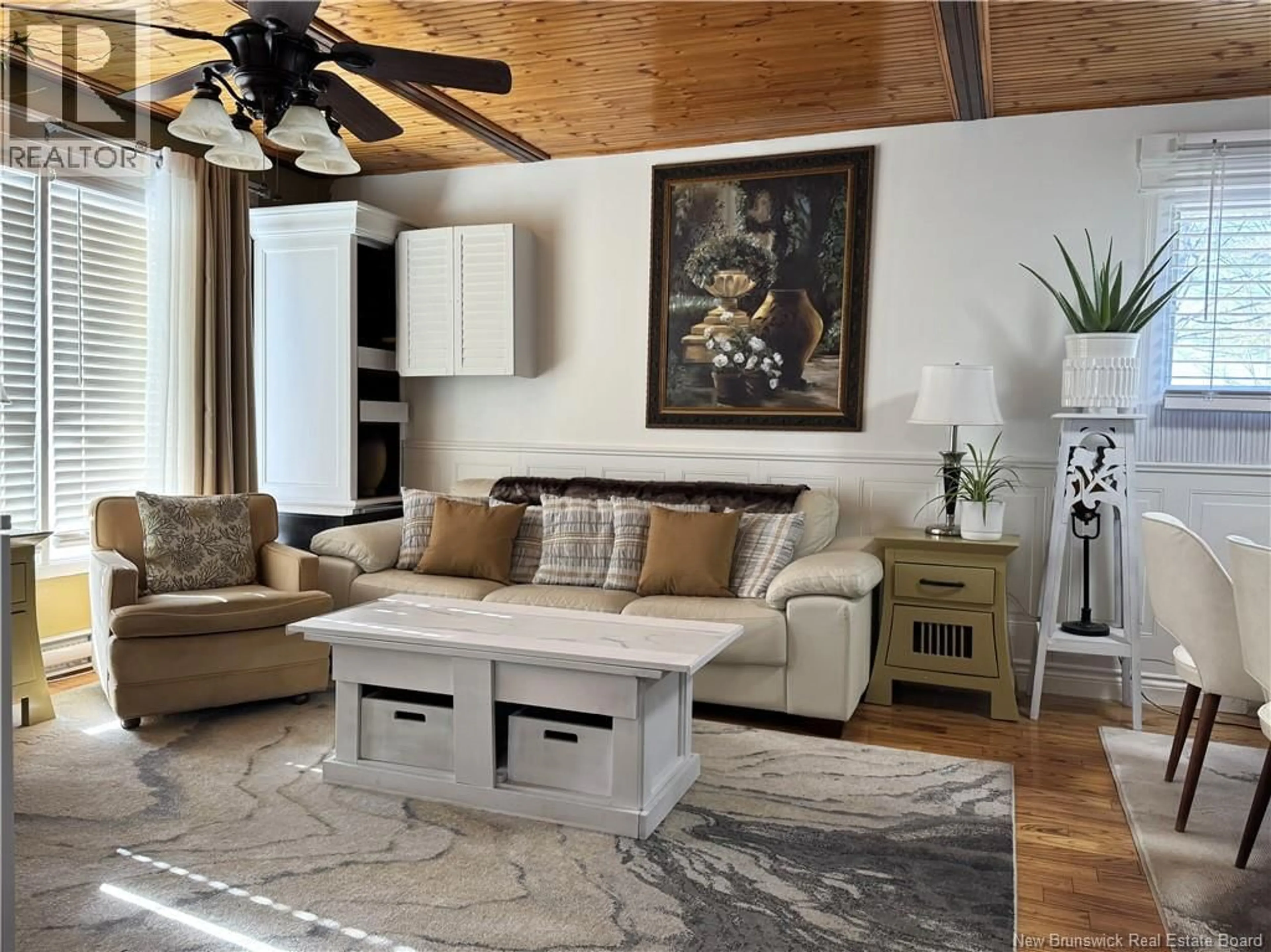 Living room with furniture, wood/laminate floor for 59-61 MAIN STREET, Fredericton New Brunswick E3A1C2