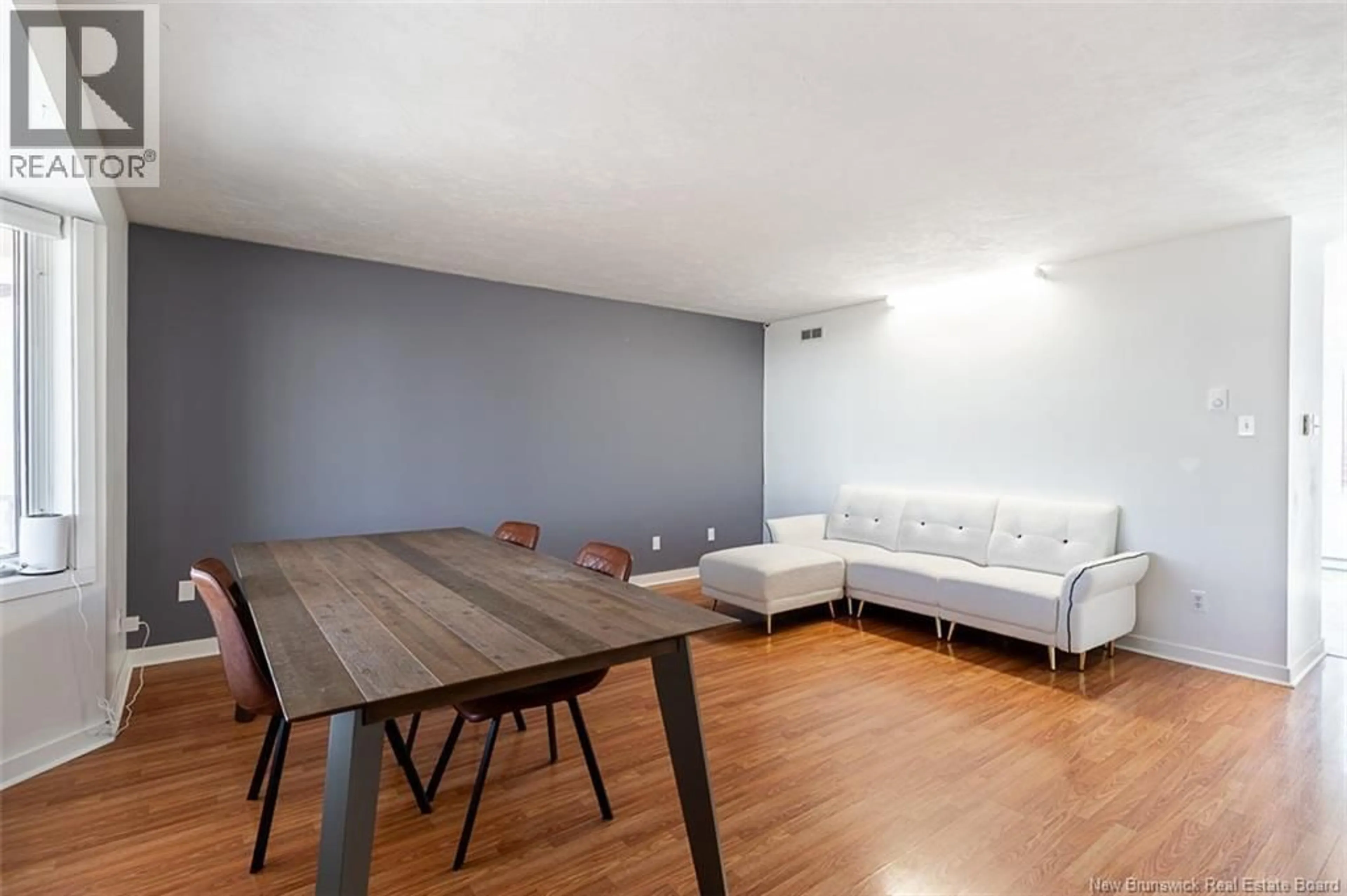 Living room with furniture, wood/laminate floor for 34 RENNICK ROAD, Moncton New Brunswick E1G2G8