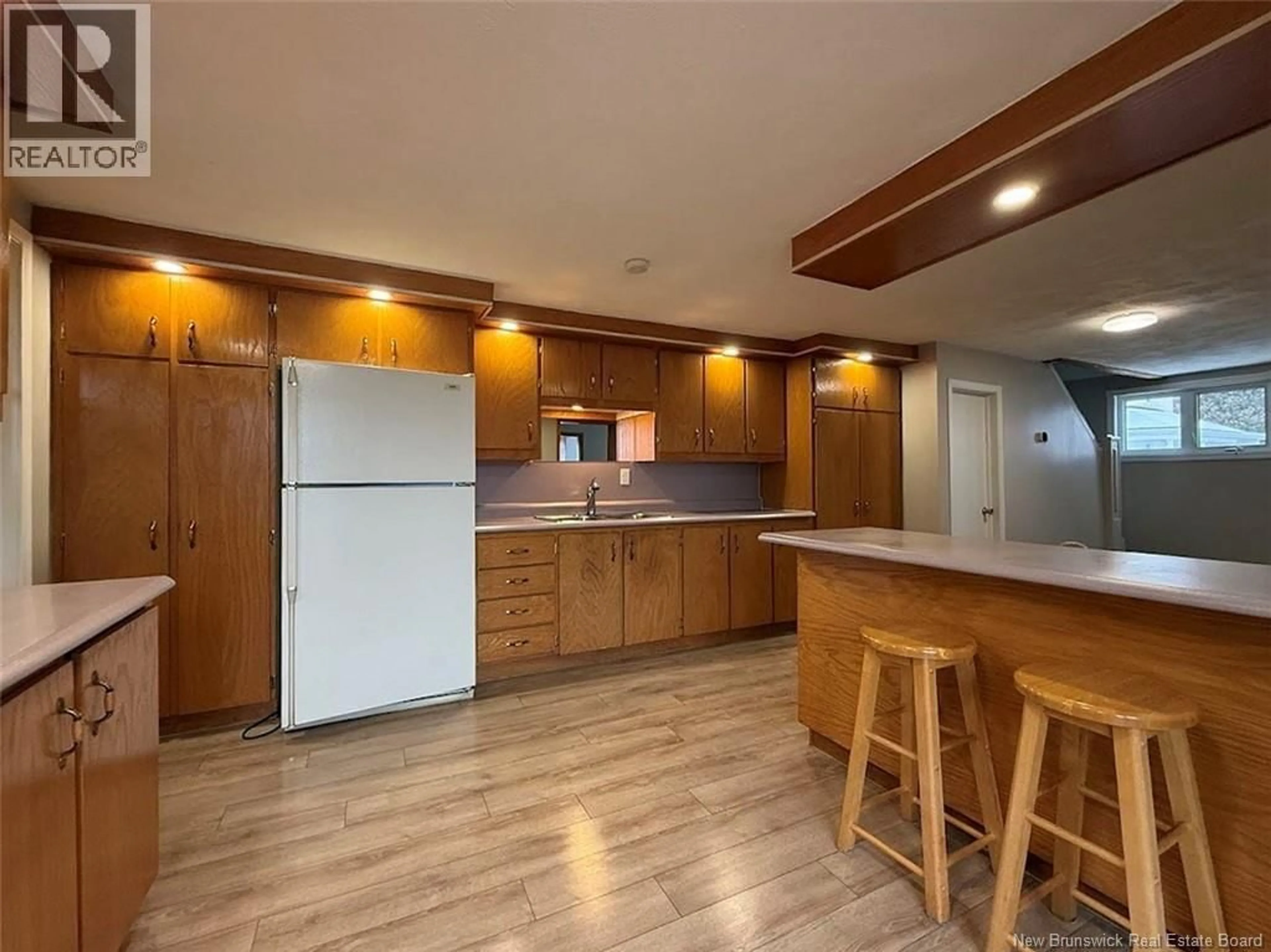 Open concept kitchen, wood/laminate floor for 49 ST-JEAN STREET, Edmundston New Brunswick E3V1C7