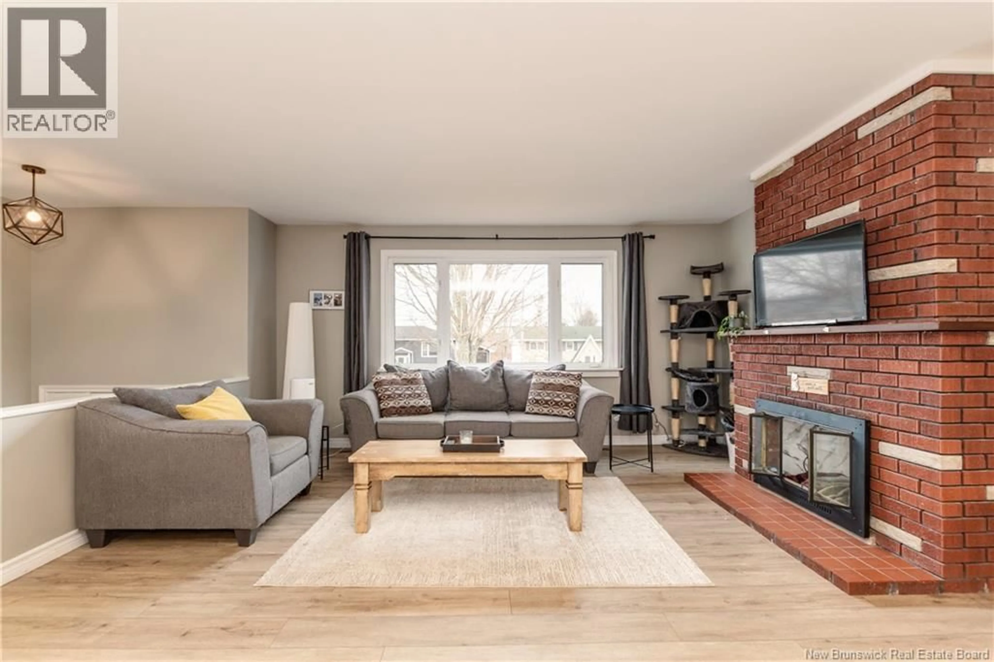 Living room with furniture, wood/laminate floor for 57 WARREN AVENUE, Riverview New Brunswick E1B3R8