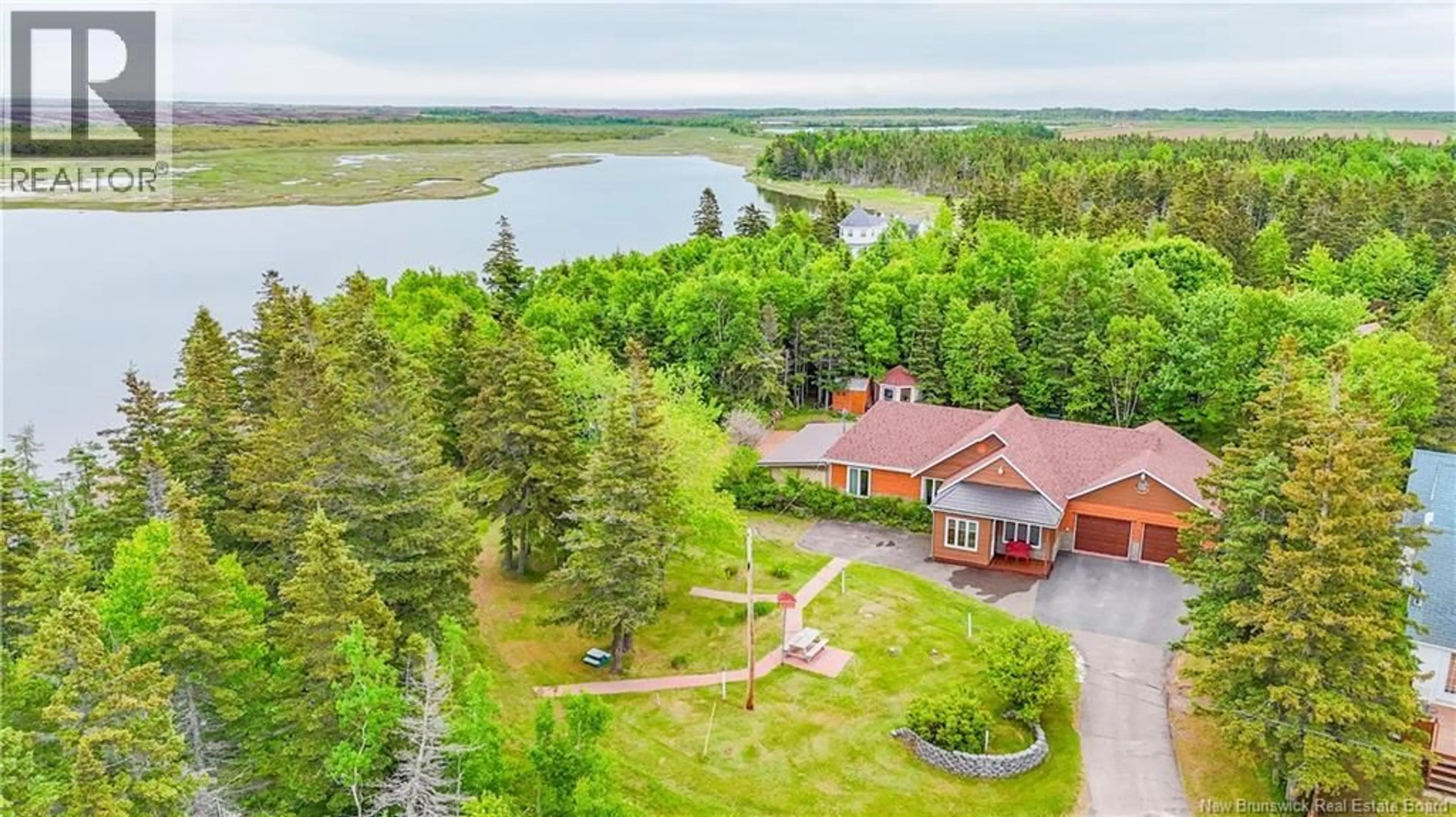 A pic from outside/outdoor area/front of a property/back of a property/a pic from drone, water/lake/river/ocean view for 4 JADI LANE, Chiasson Office New Brunswick E8S2S6