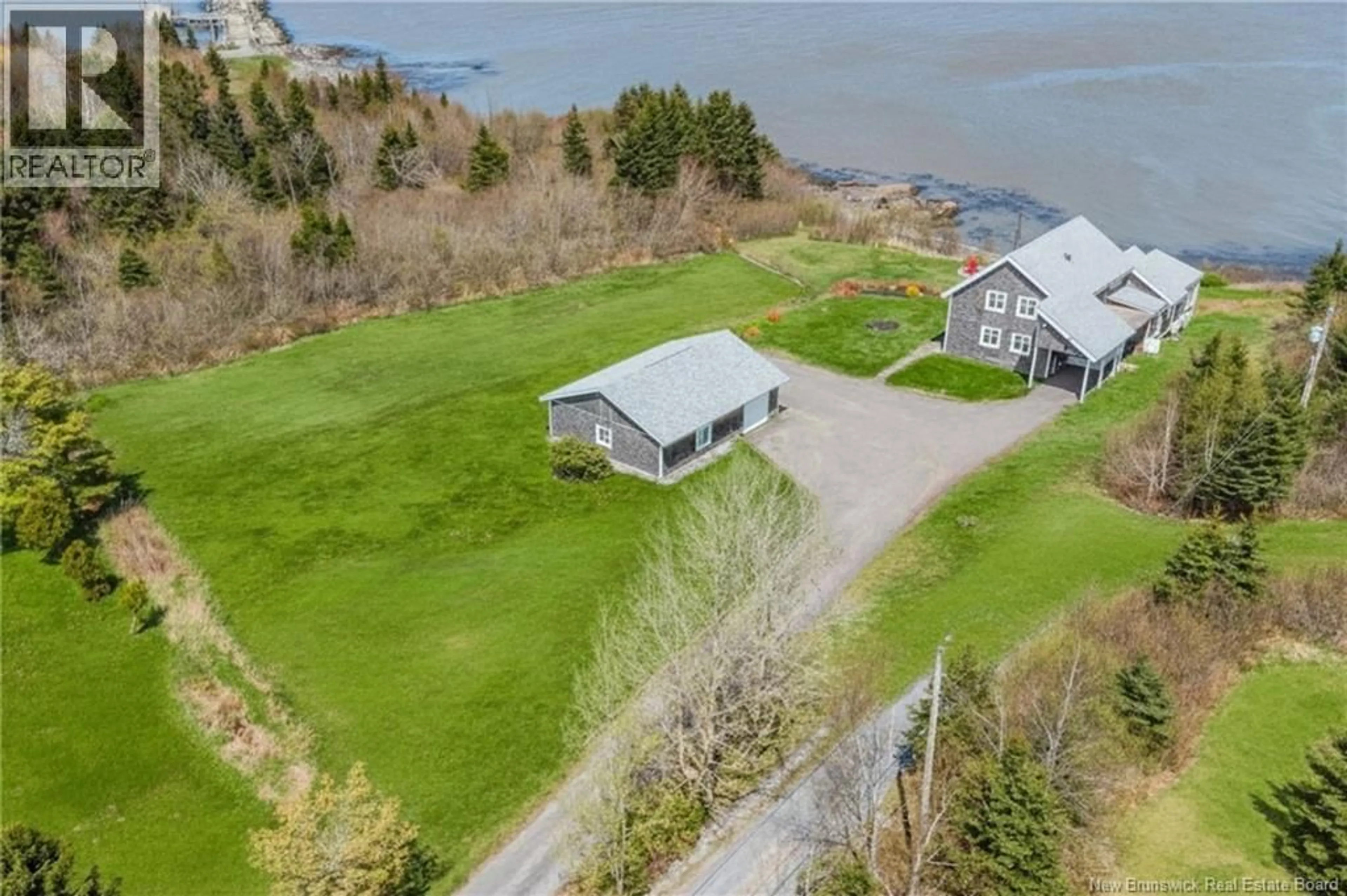 A pic from outside/outdoor area/front of a property/back of a property/a pic from drone, water/lake/river/ocean view for 396 POINT ROAD, Saint John New Brunswick E2M7J9