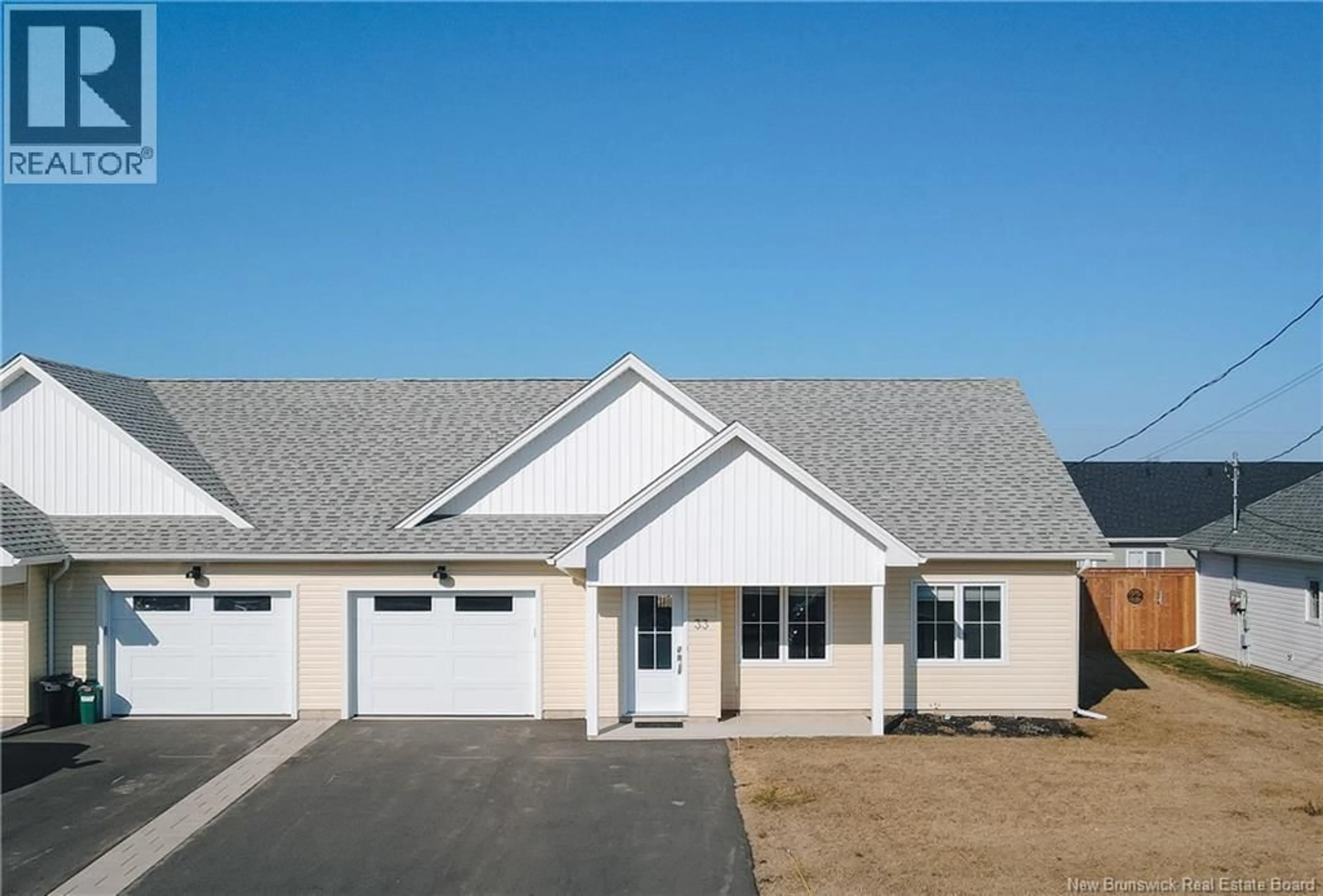 Home with vinyl exterior material, street for 33 MACKINNON STREET, Grand-Barachois New Brunswick E4P0R6