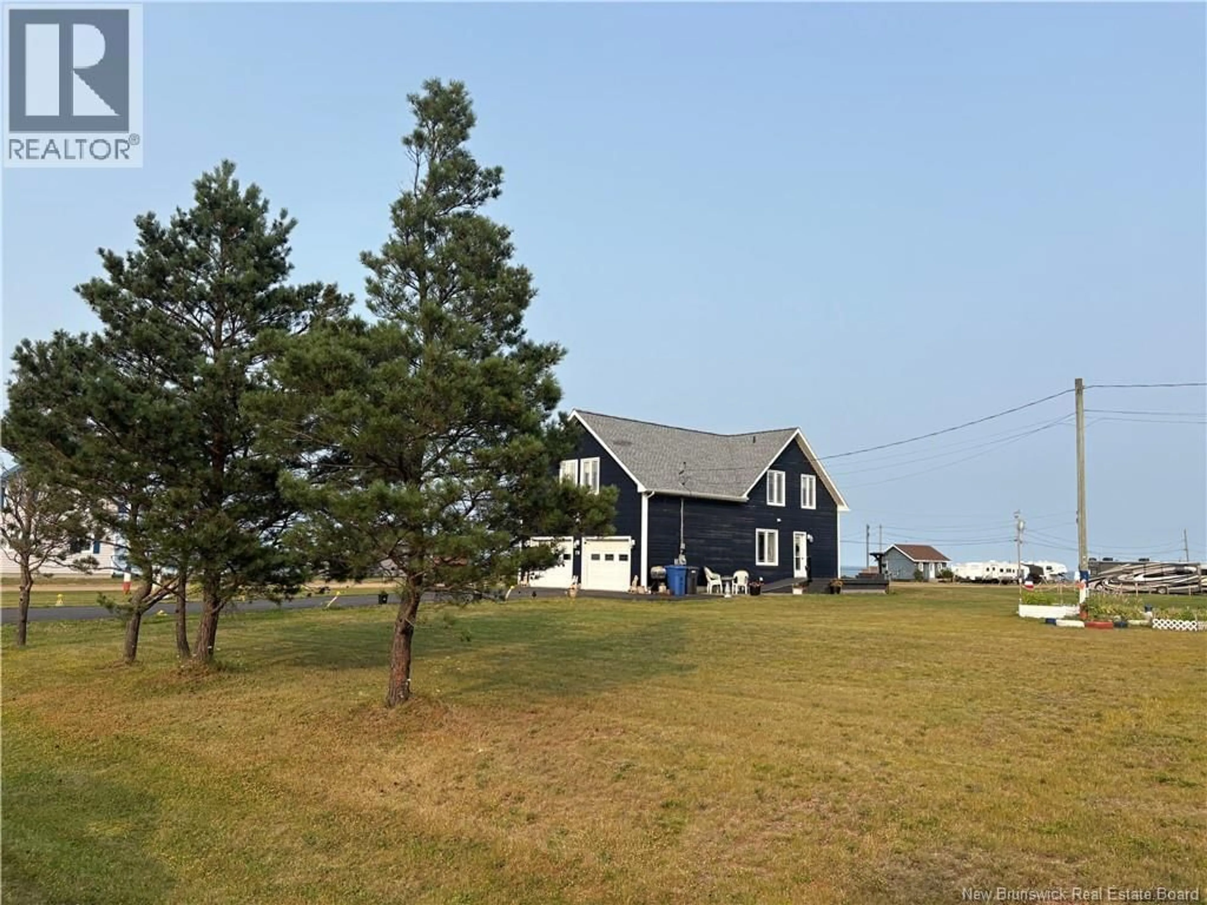 A pic from outside/outdoor area/front of a property/back of a property/a pic from drone, unknown for 78 RUE DES CHAMPS, Pointe-Verte New Brunswick E8J2V4