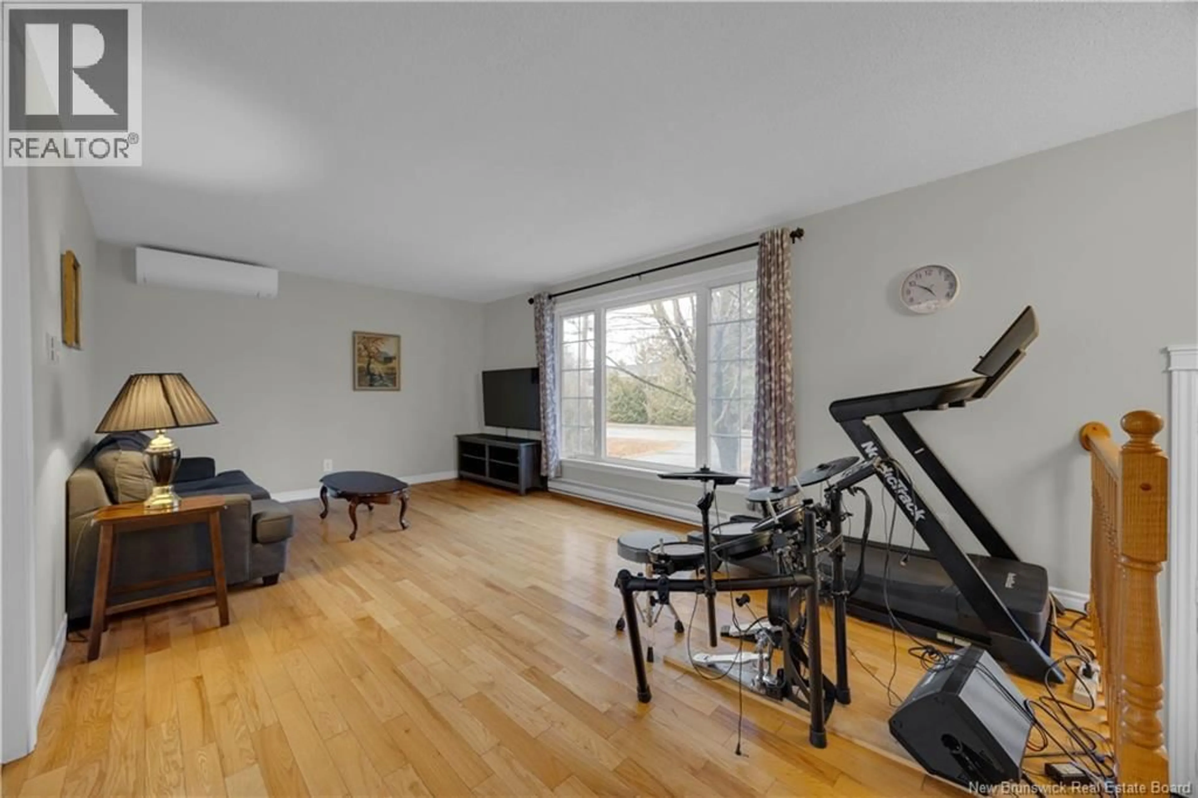 Living room with furniture, wood/laminate floor for 37 MILLICAN DRIVE, Quispamsis New Brunswick E2E4V4