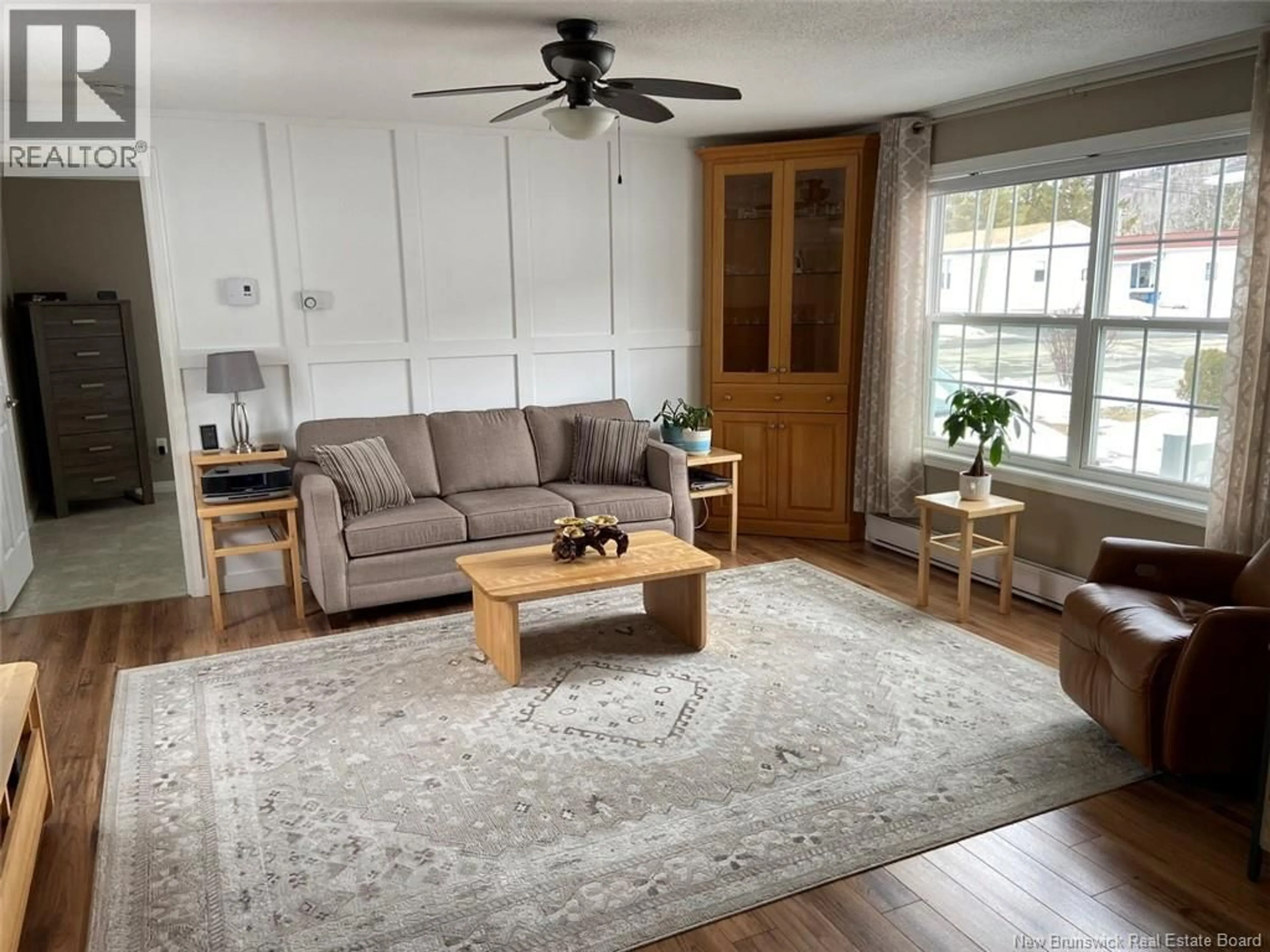 Living room with furniture, wood/laminate floor for 45 ALBERT ROAD, Saint-Jacques New Brunswick E7B1Z6