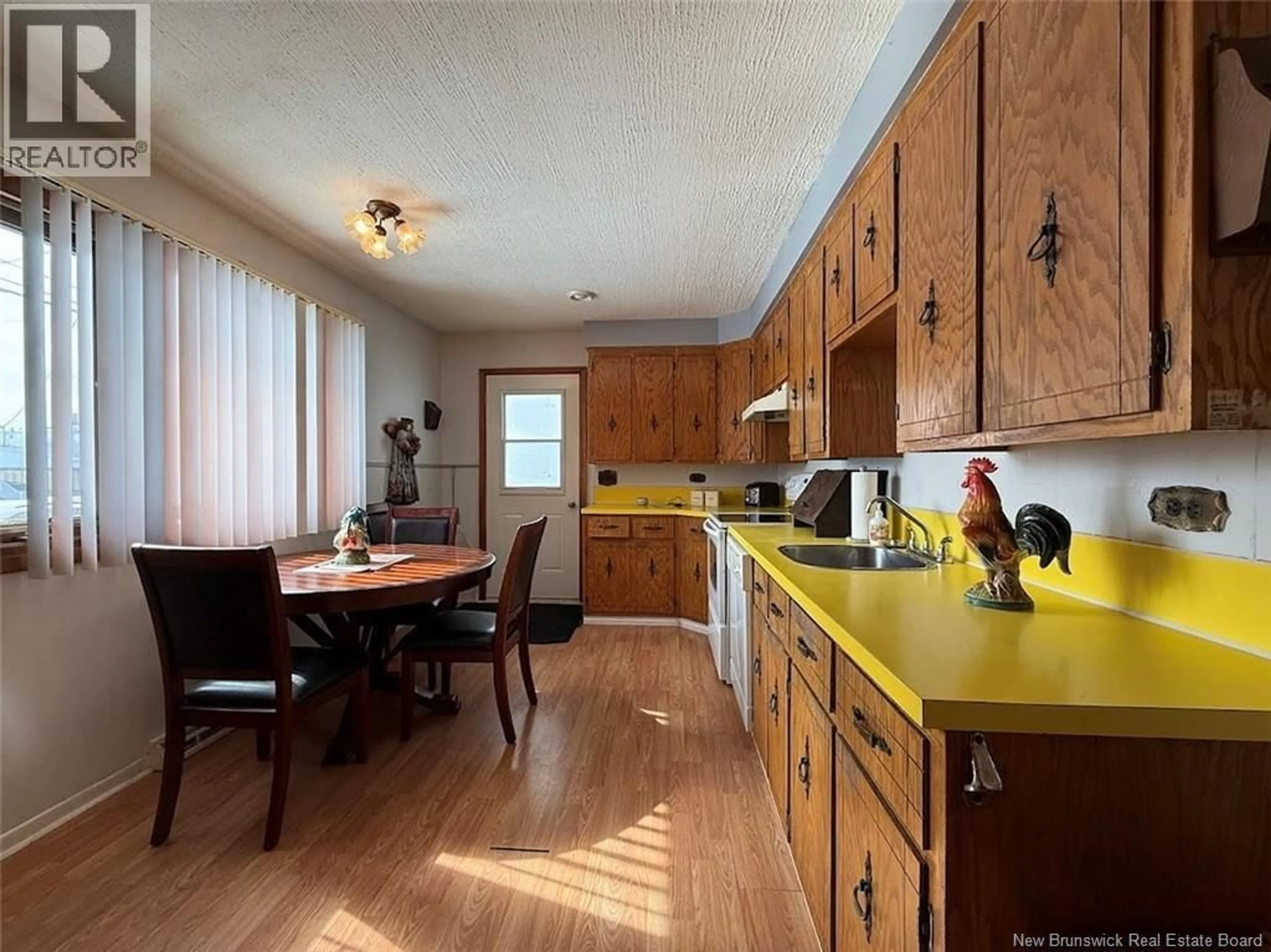 Open concept kitchen, wood/laminate floor for 52 47TH AVENUE, Edmundston New Brunswick E3V3C2