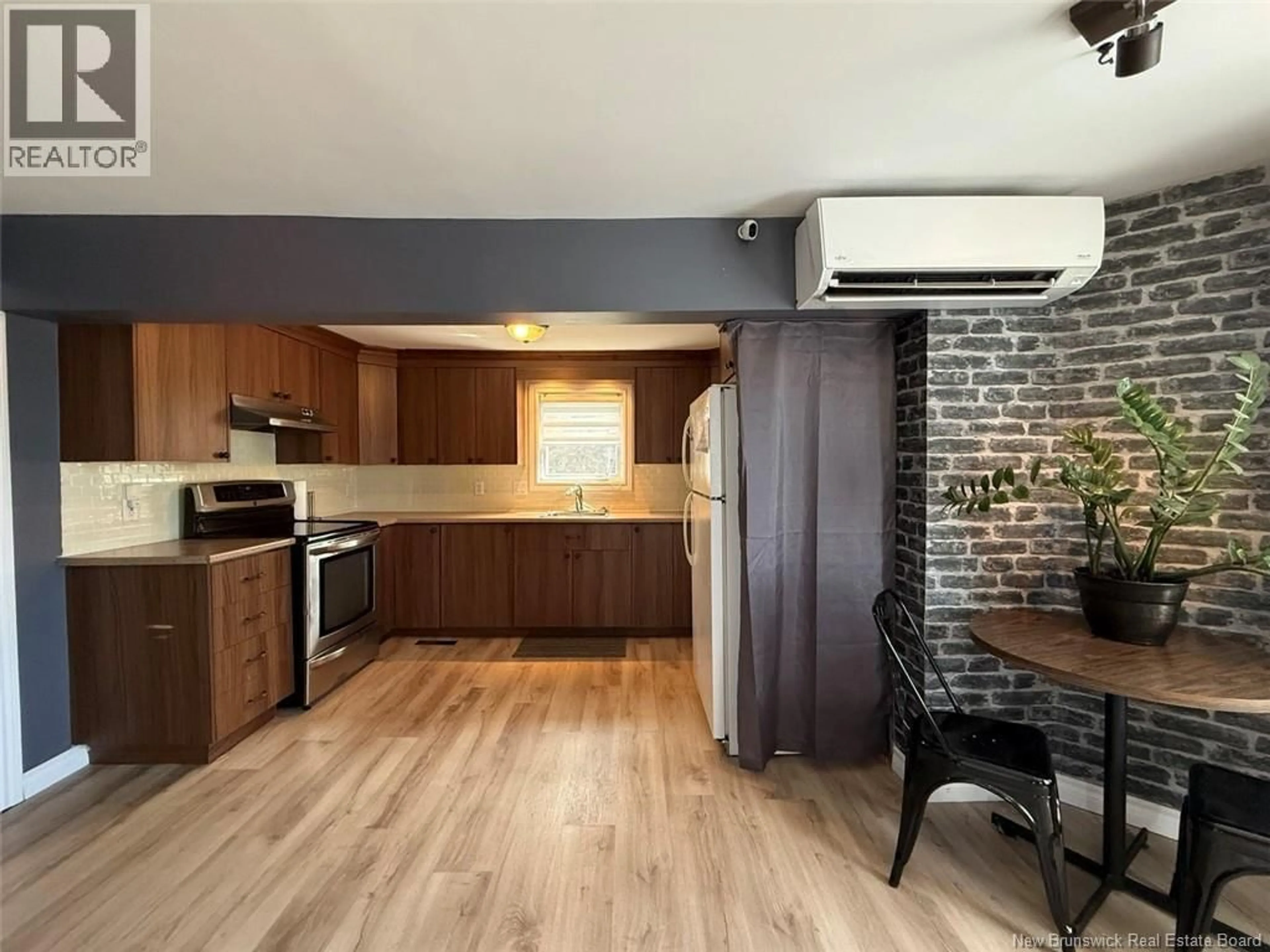 Open concept kitchen, wood/laminate floor for 57 POWER ROAD, Edmundston New Brunswick E3V2X7