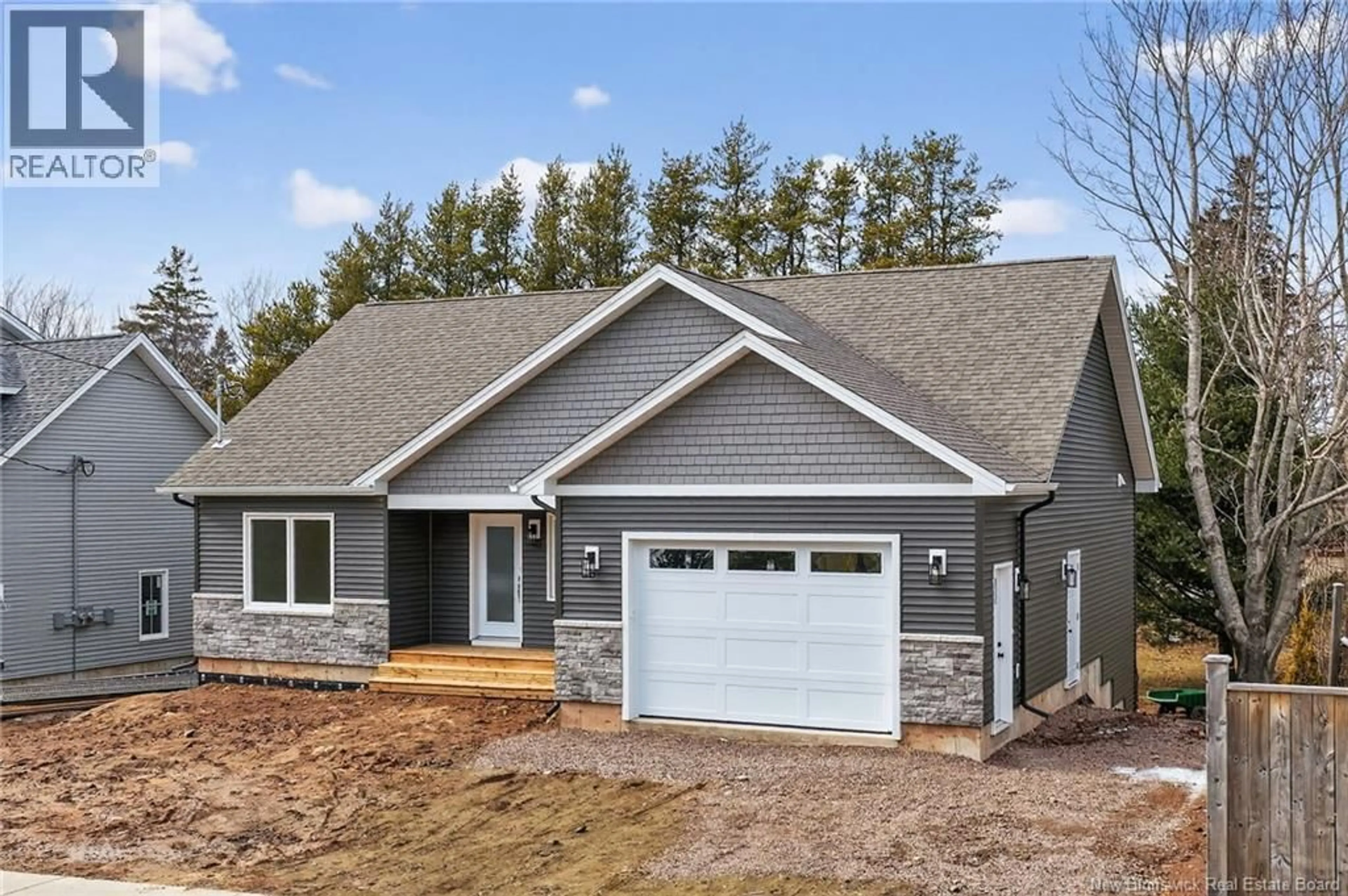 Home with vinyl exterior material, street for 214 BREAUX BRIDGE STREET, Shediac New Brunswick E4P0Y3