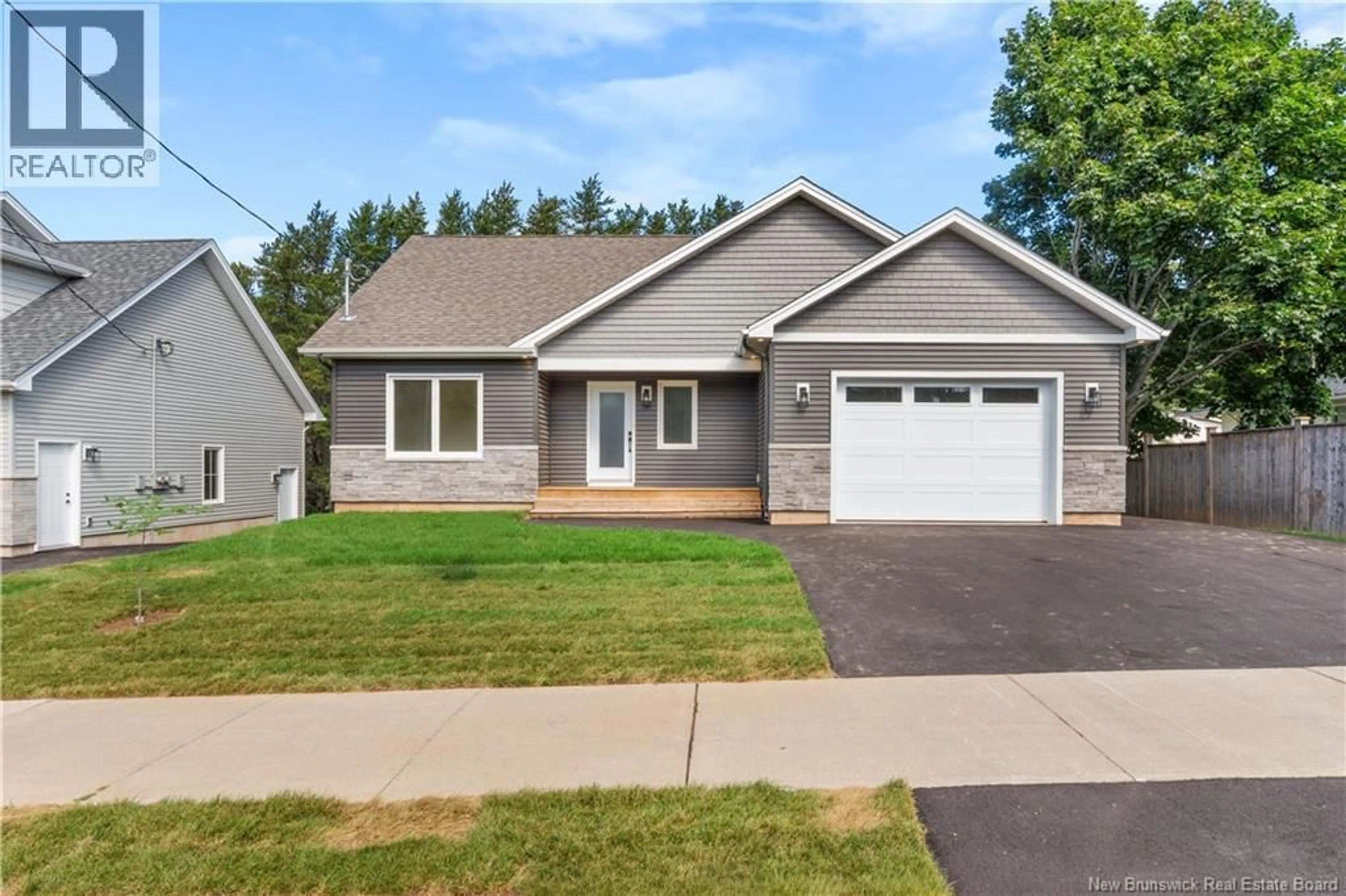 Home with vinyl exterior material, street for 214 BREAUX BRIDGE STREET, Shediac New Brunswick E4P0Y3