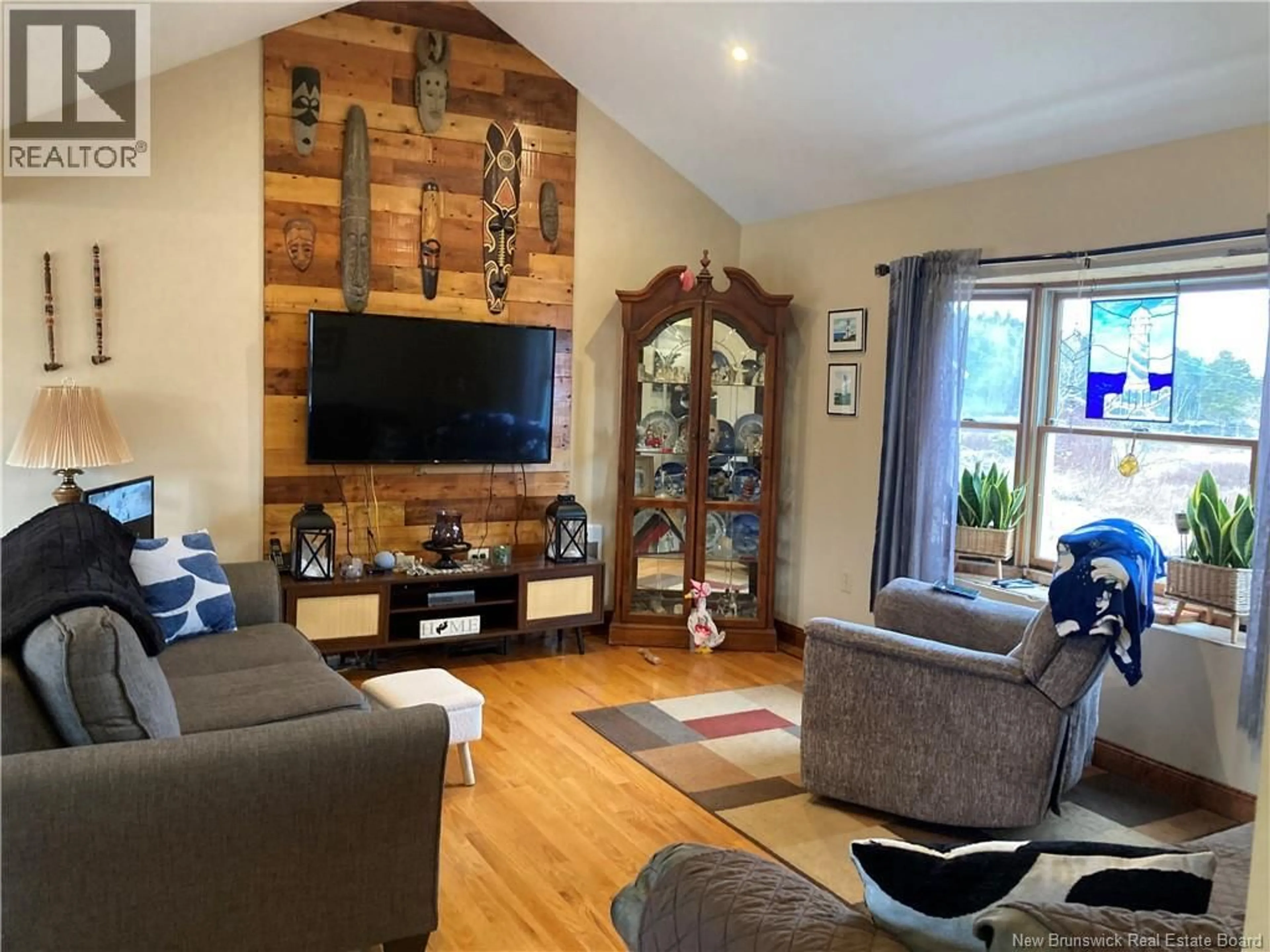 Living room with furniture, wood/laminate floor for 2140 ROUTE 774, Wilsons Beach New Brunswick E5E1L2