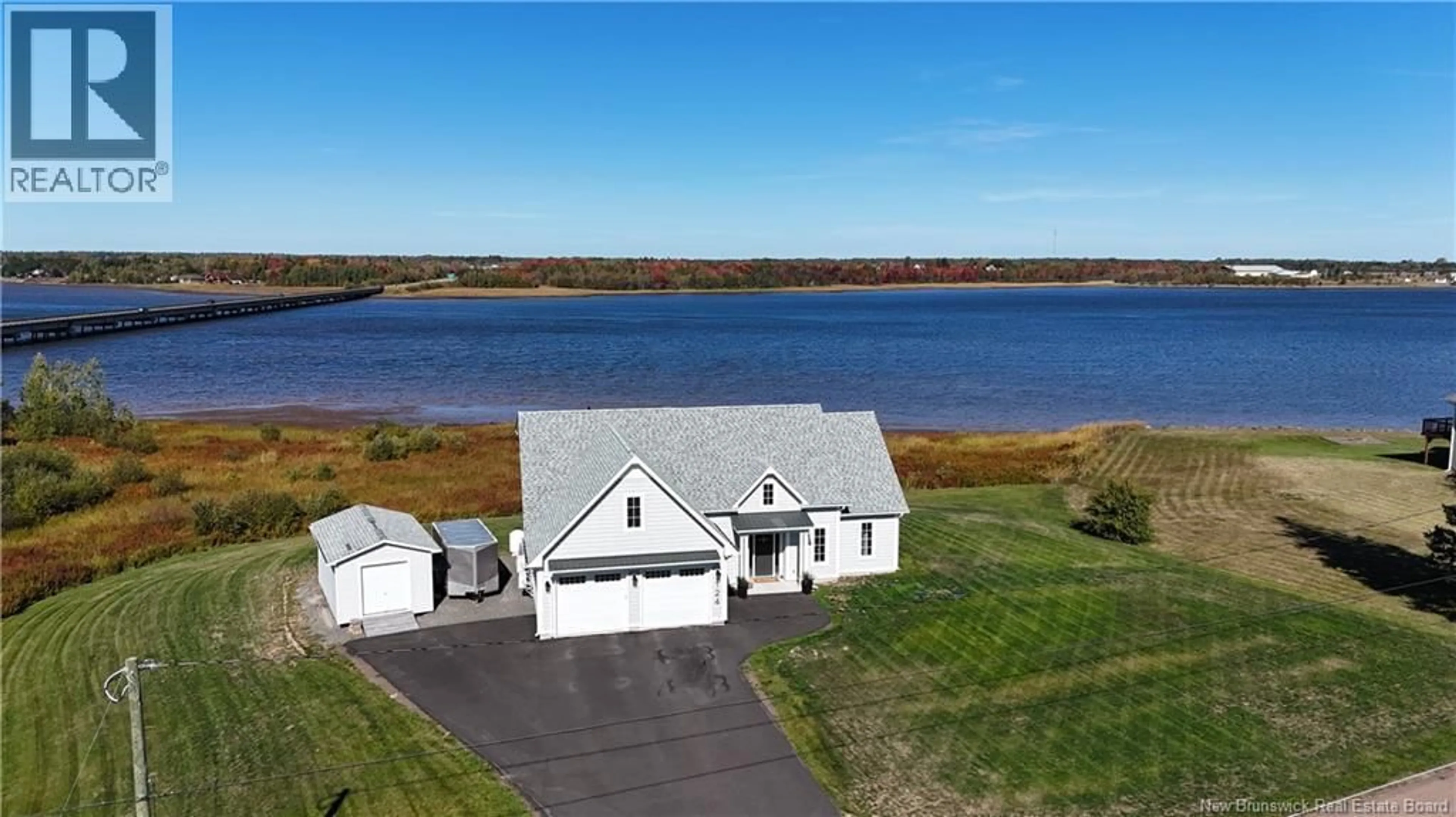 A pic from outside/outdoor area/front of a property/back of a property/a pic from drone, water/lake/river/ocean view for 124 RIVE SUD, Cocagne New Brunswick E4R2W9