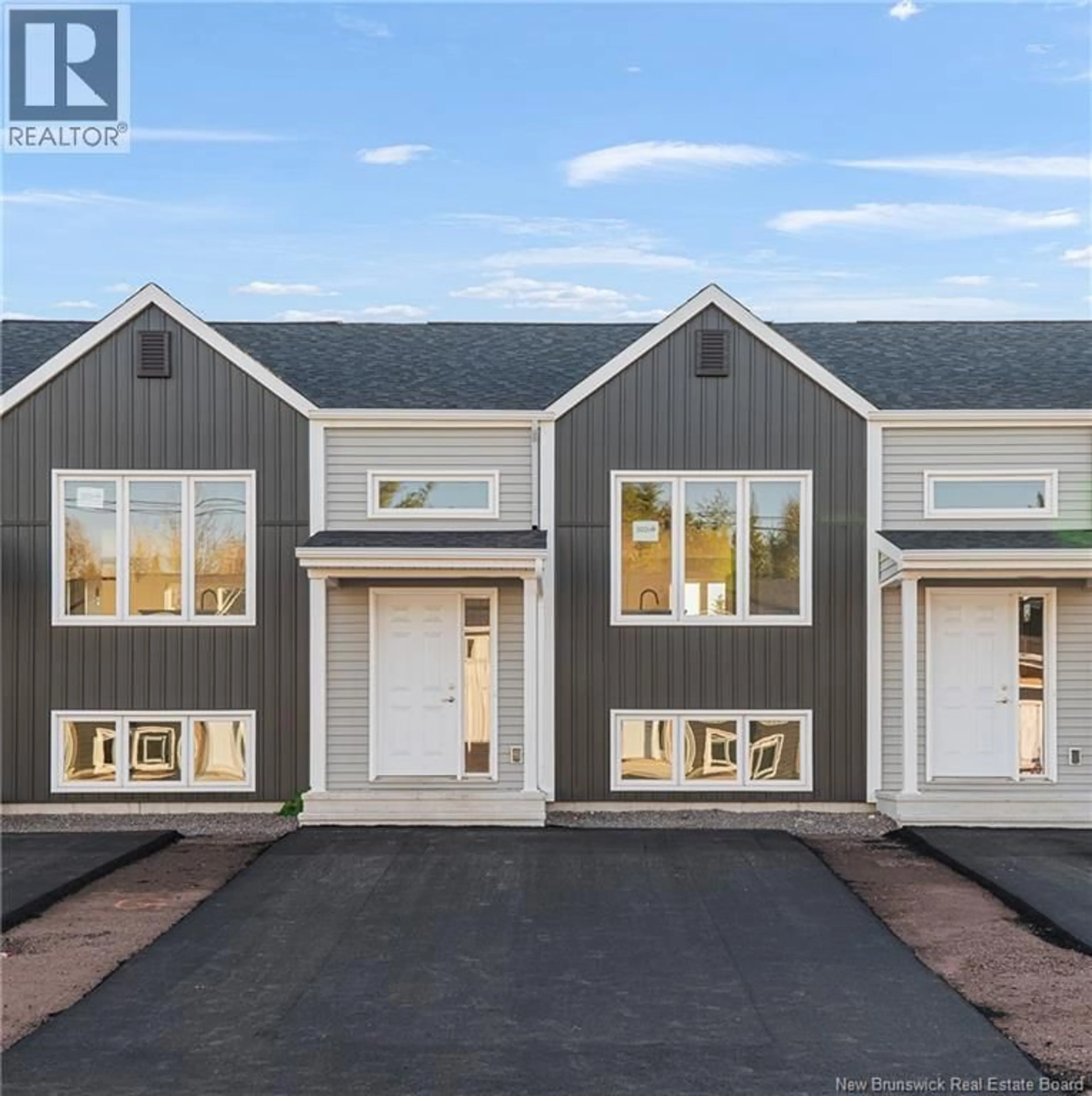 Home with vinyl exterior material, street for 303 ELSLIGER STREET, Dieppe New Brunswick E1K0A5