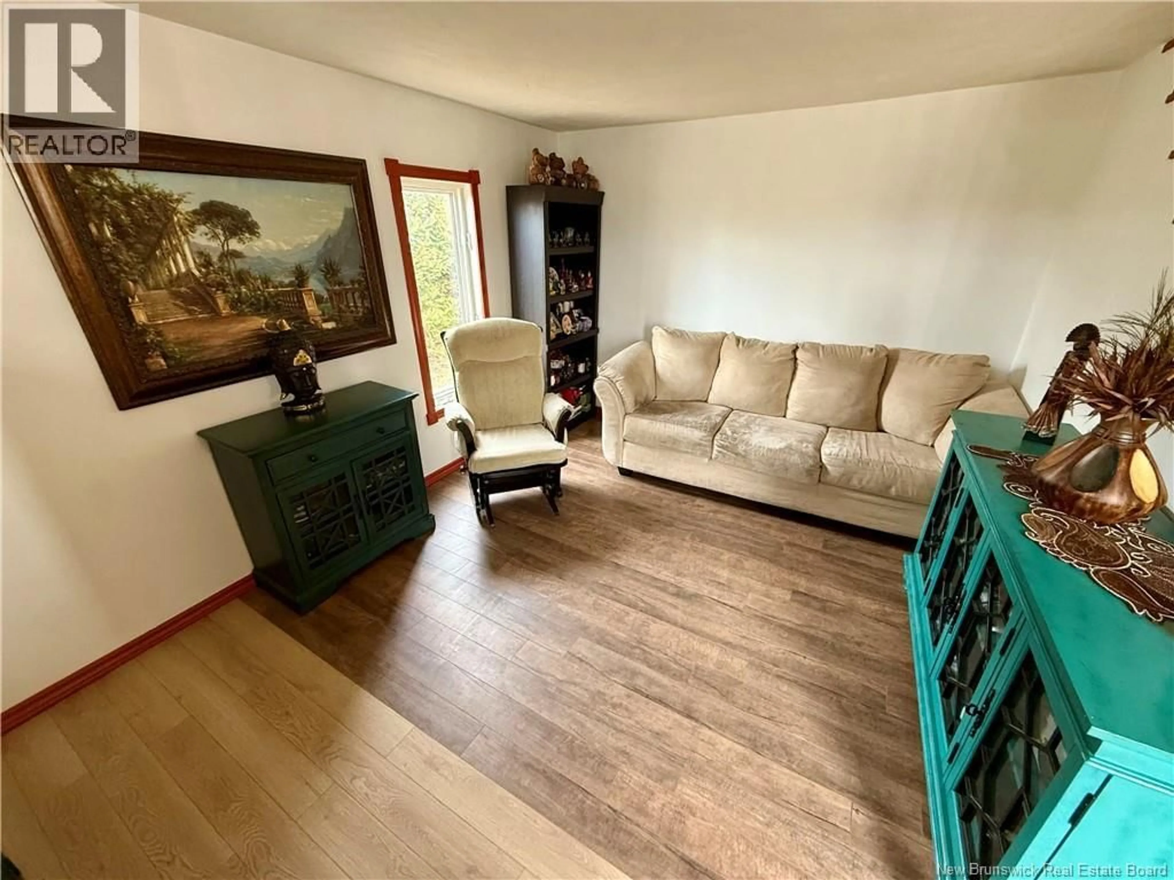 Living room with furniture, wood/laminate floor for 74 DE L'ECOLE STREET, Rogersville New Brunswick E4Y1V7