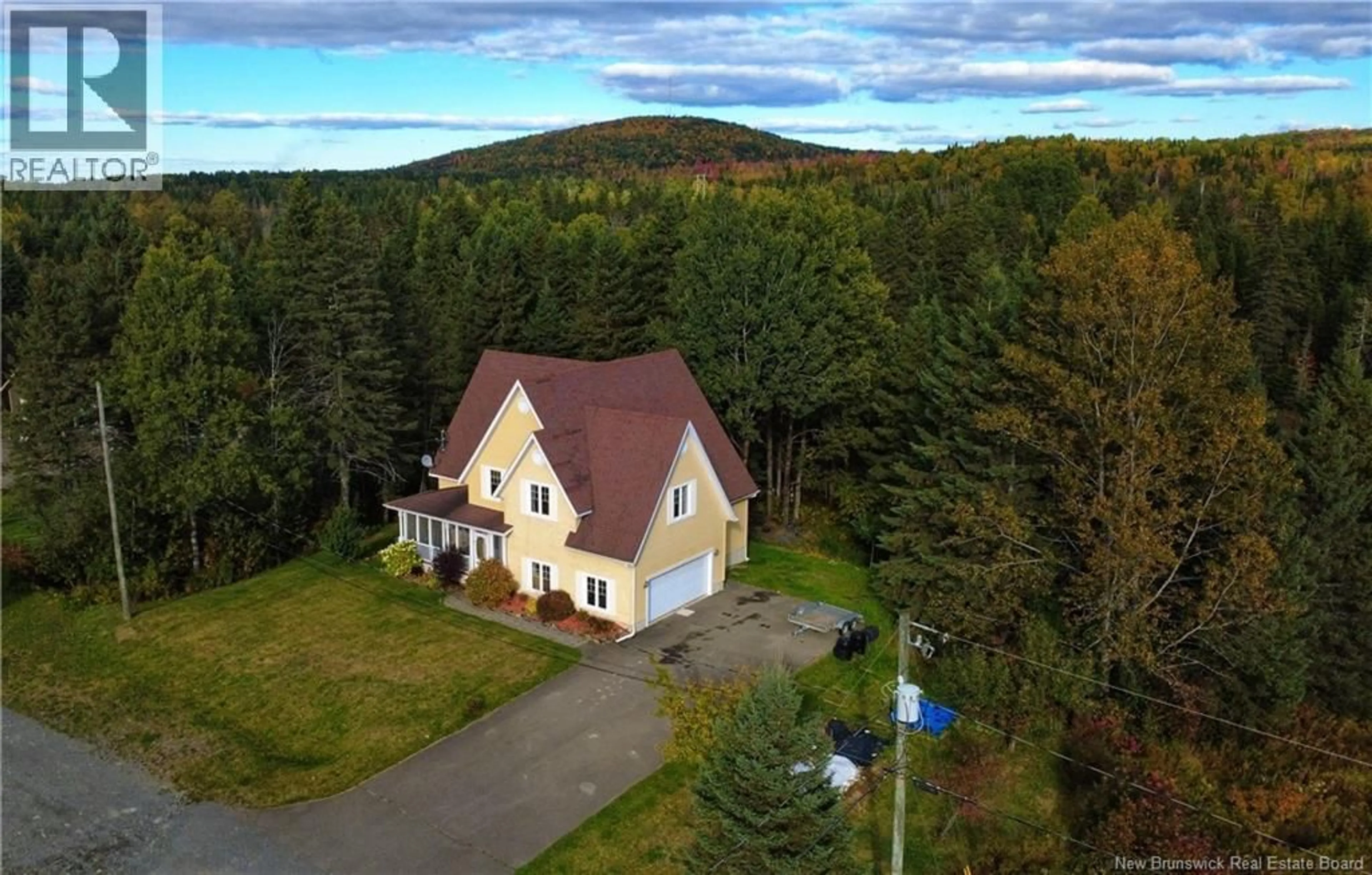 A pic from outside/outdoor area/front of a property/back of a property/a pic from drone, unknown for 6 RUE DES MERLES, Kedgwick New Brunswick E8B2C7