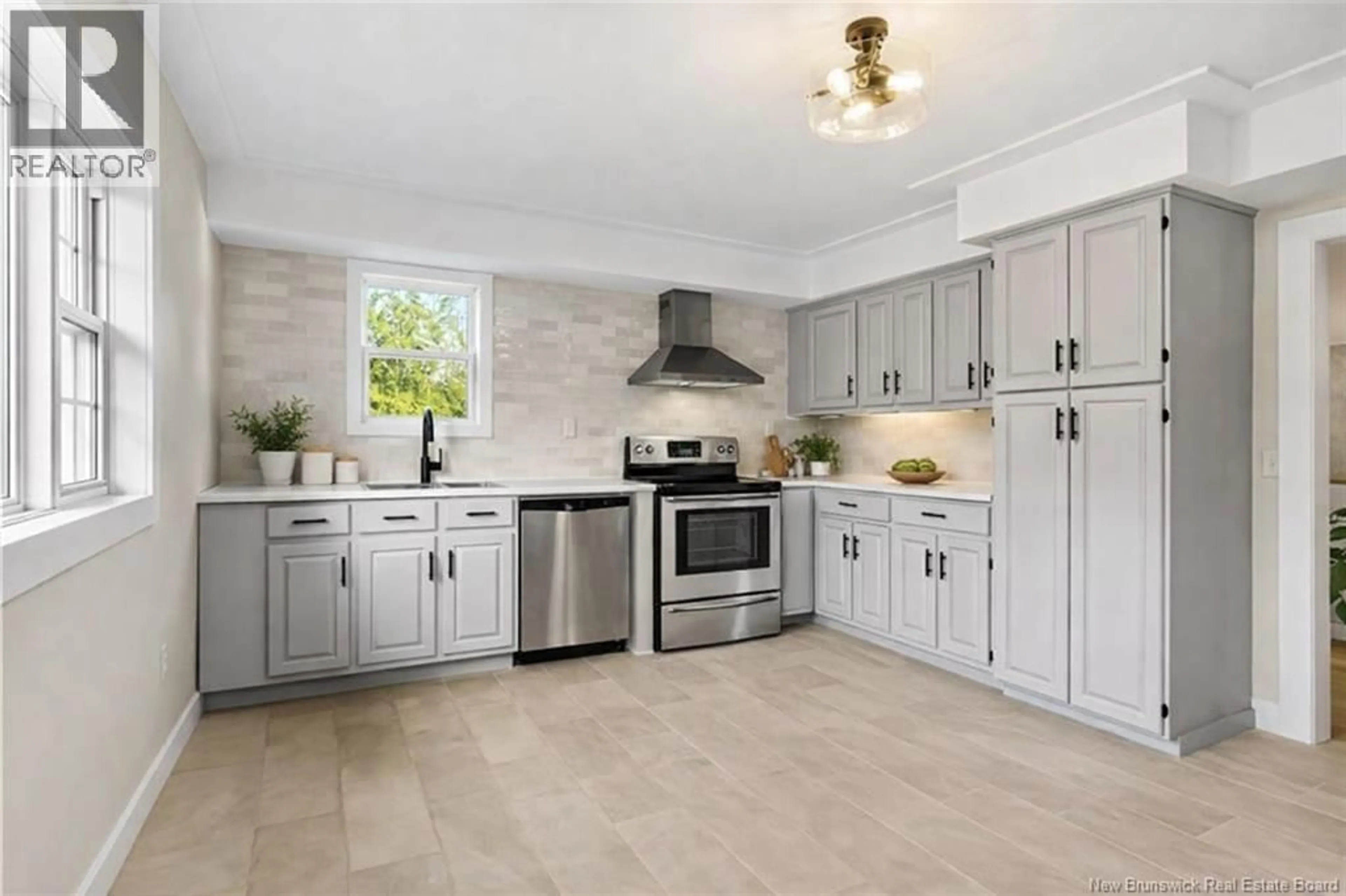 Open concept kitchen, ceramic/tile floor for 23 ANGUS DRIVE, Grand-Barachois New Brunswick E4P8V9