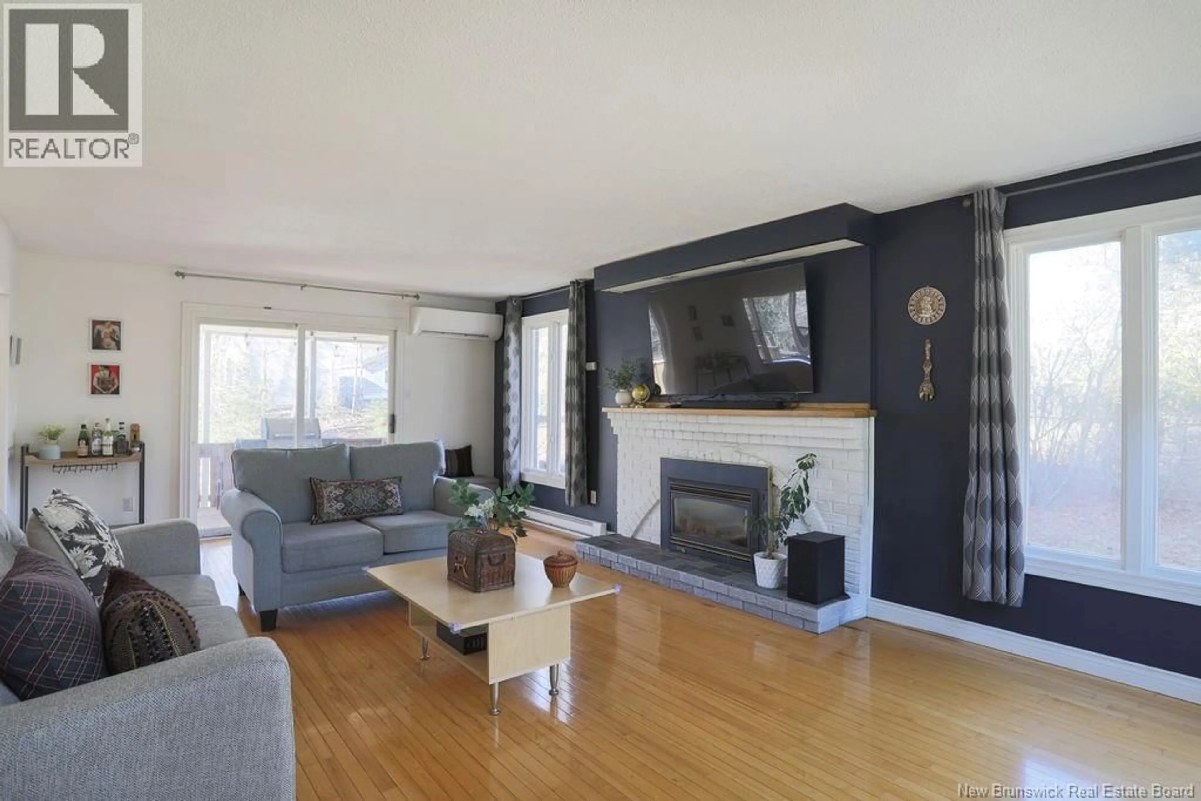 Living room with furniture, wood/laminate floor for 30 ROLLING HILLS DRIVE, Rothesay New Brunswick E2H2P3