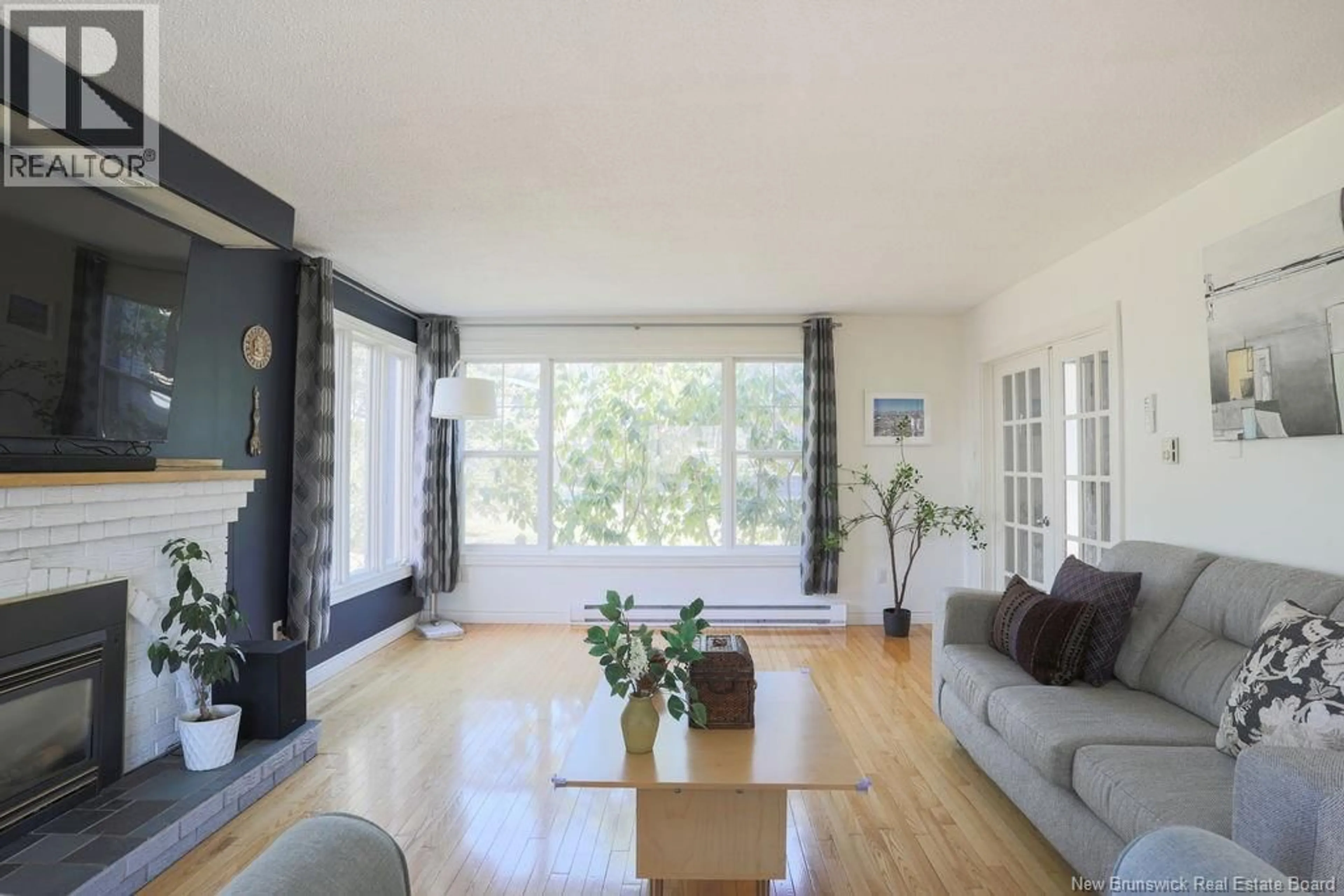 Living room with furniture, wood/laminate floor for 30 ROLLING HILLS DRIVE, Rothesay New Brunswick E2H2P3