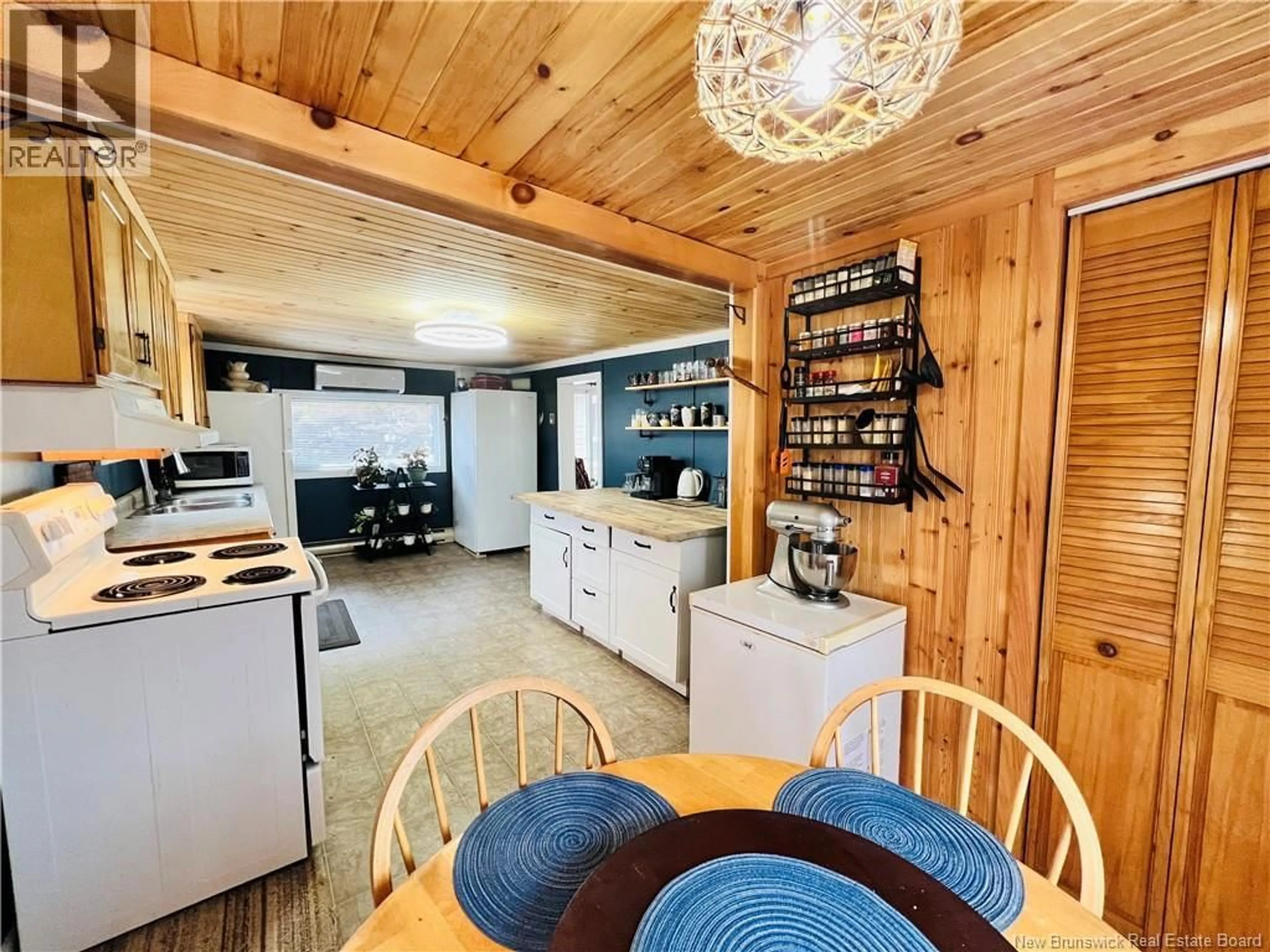 Open concept kitchen, wood/laminate floor for 292 ROUTE 772, Lords Cove New Brunswick E5V1J8