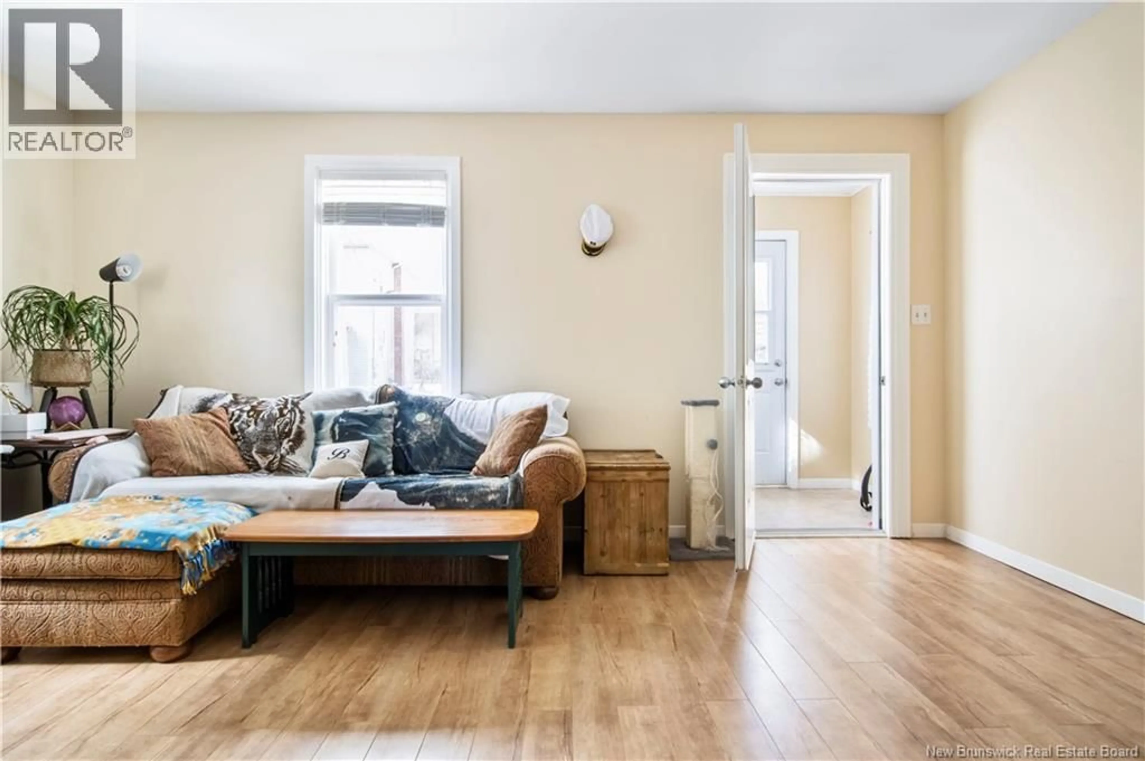 Living room with furniture, wood/laminate floor for 163 NORTH STREET, Moncton New Brunswick E1C5X9