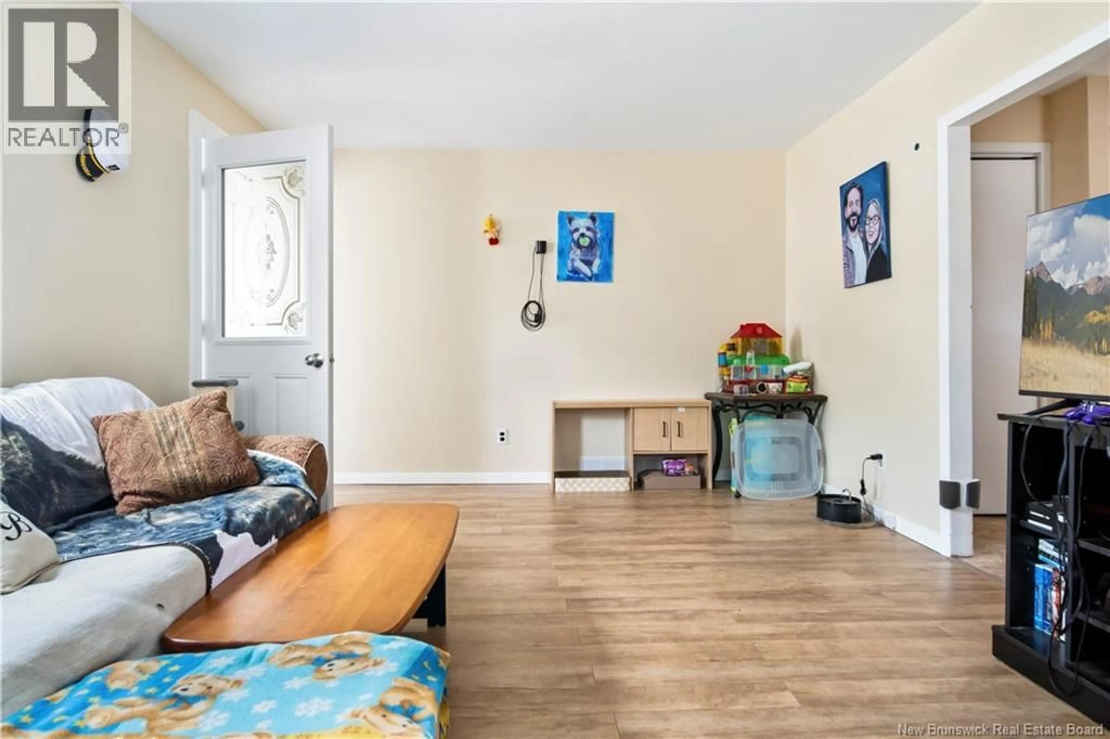 Living room with furniture, wood/laminate floor for 163 NORTH STREET, Moncton New Brunswick E1C5X9